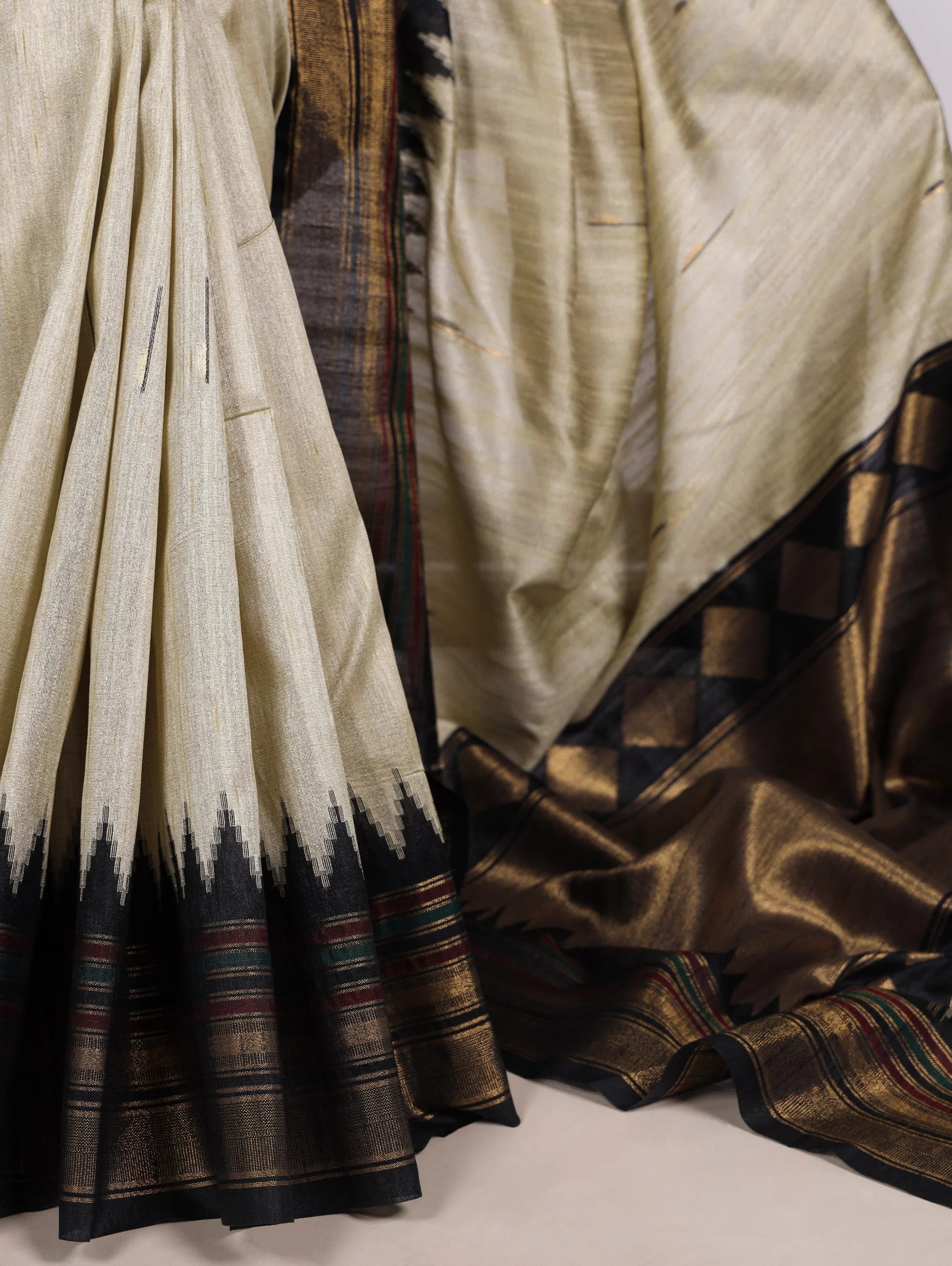 cream bhagalpuri silk saree black zari border drape detail