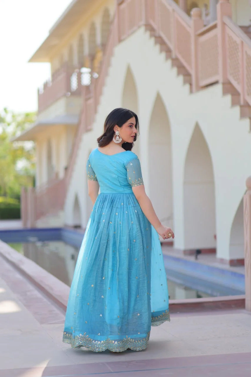 sky blue floral gown back view with sequin hem