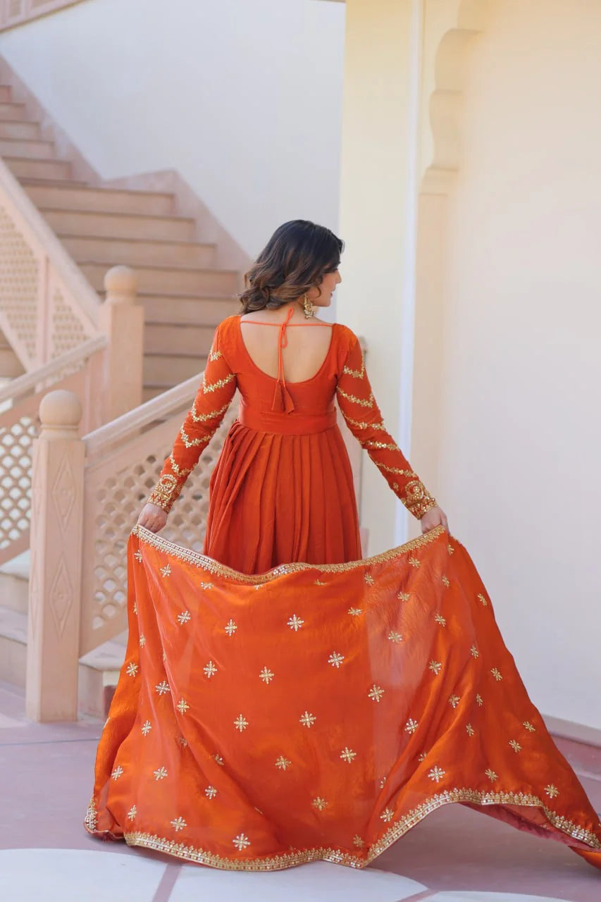 rust orange silk gown back view with embroidered dupatta