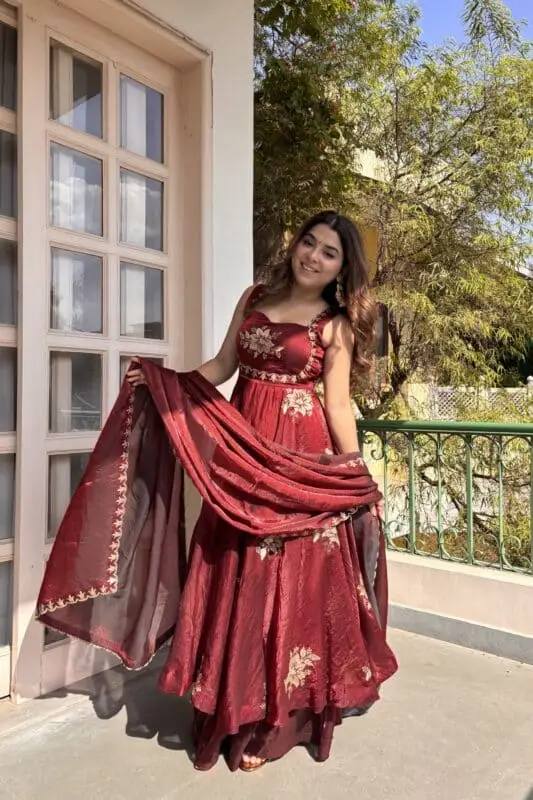 Side view of wine embroidered Fendy silk Anarkali palazzo set with floral motifs for ethnic wear