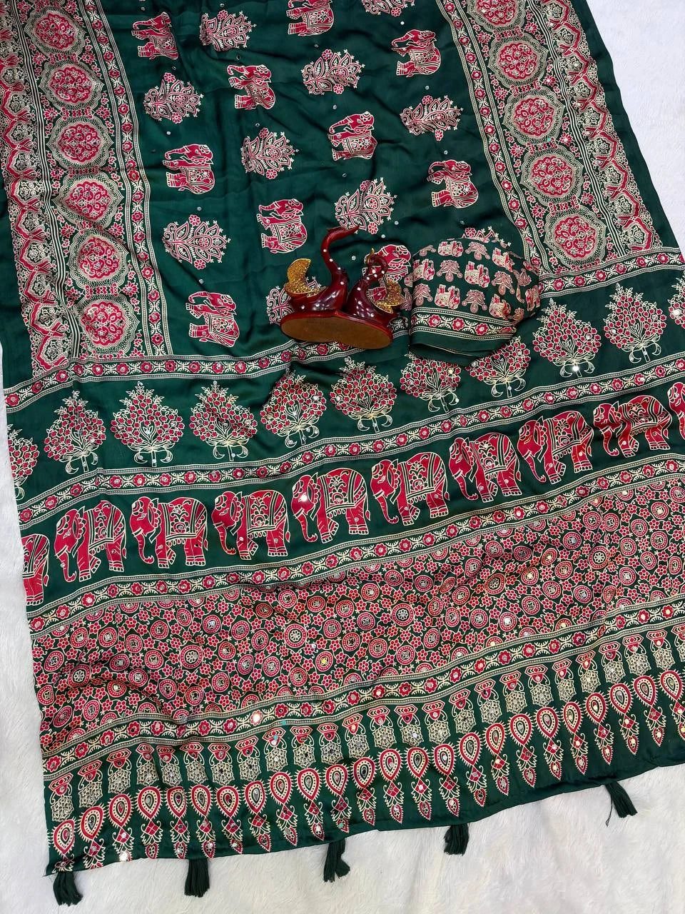 Ajrakh elephant print saree dark green pallu detail showing elephant rows and latkans