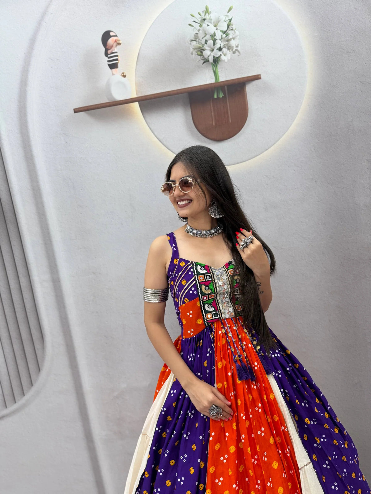 back view of purple orange bandhej navratri chaniya choli with tie-up choli