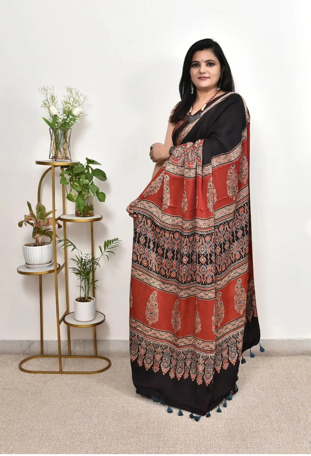 black ajrakh print saree pallu close up with traditional ajrakh motifs