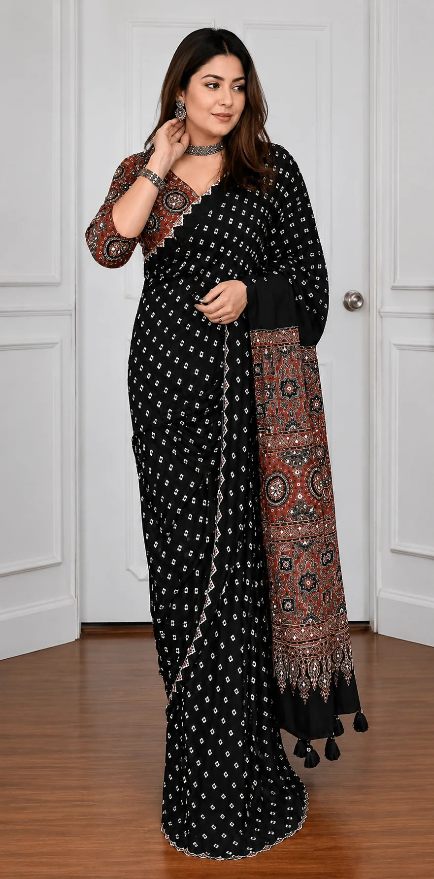 black ajrakh saree with mirror work and rust brown printed pallu full drape