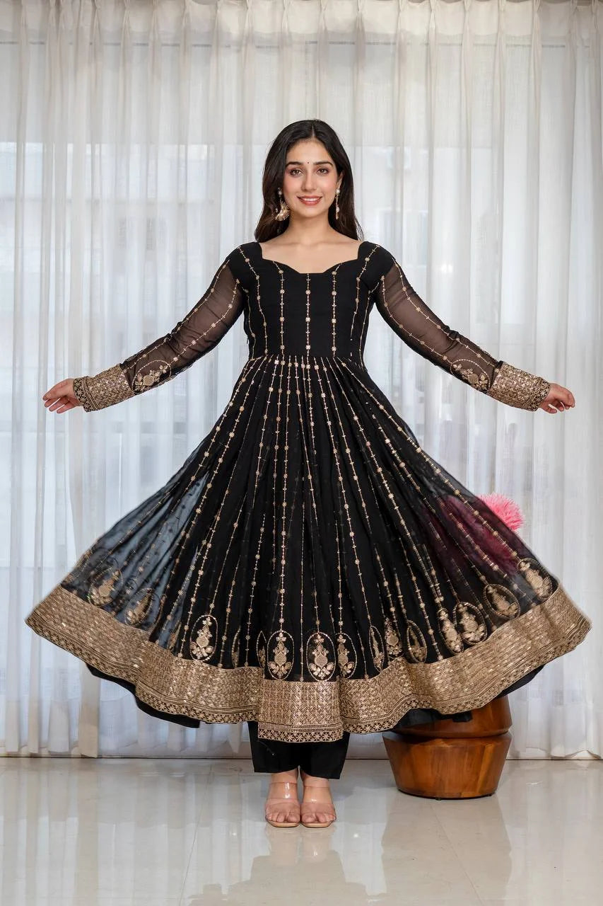 Black anarkali suit kali cut flared view showing gold border and sequin embroidery
