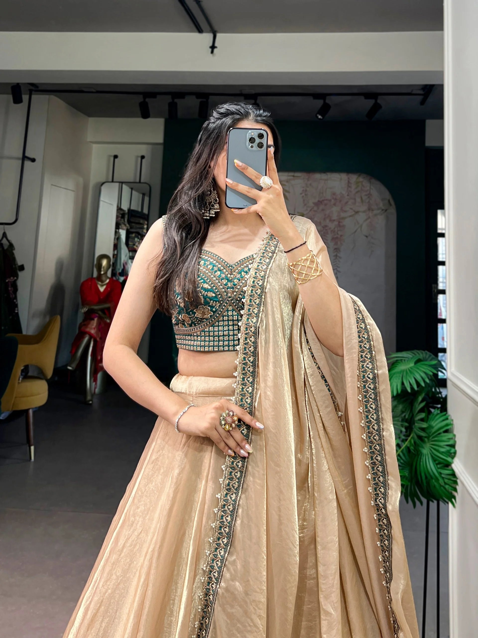 Champagne fendi silk lehenga with teal sequin embroidery blouse front view