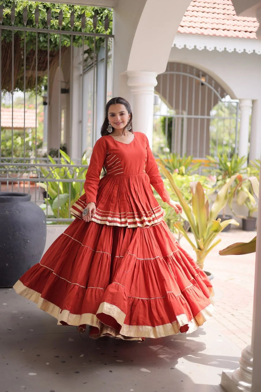 Rust navratri lehenga choli with 12 metre flair and golden lace border