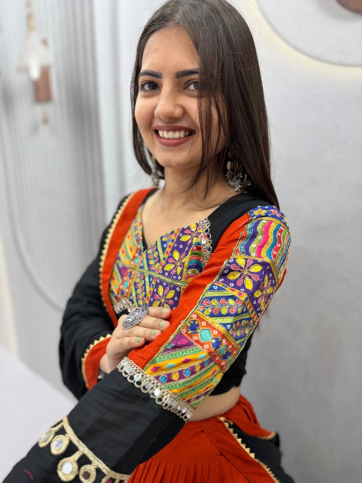 Kutchi mirror-work sleeve of cotton navratri chaniya choli with gamthi embroidery - close-up