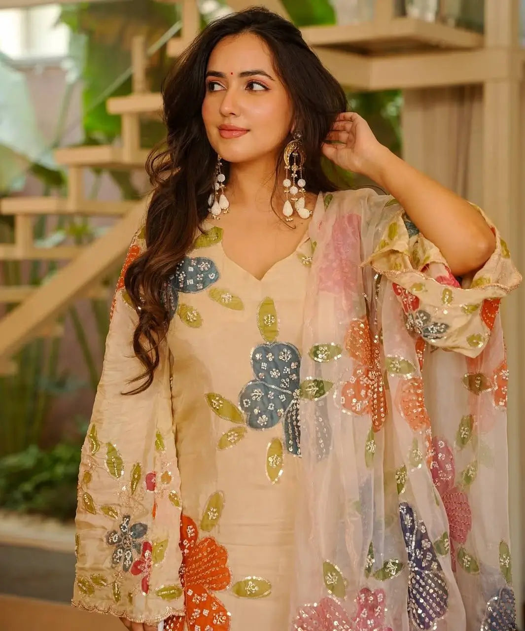 Close-up of cream organza silk kurta with multicolour brush print and sequin embroidery