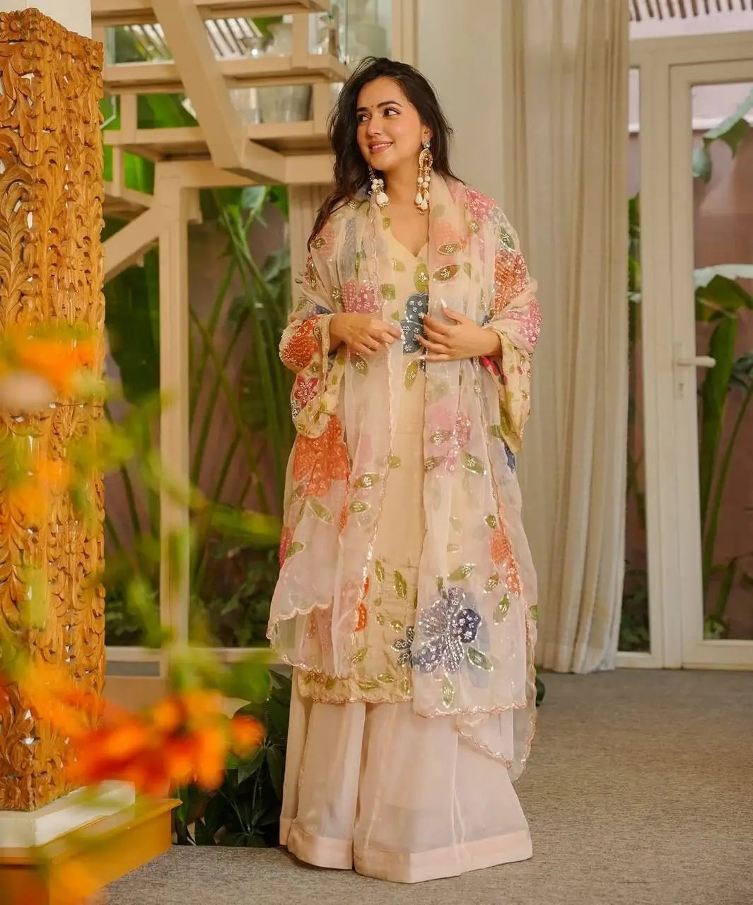 Cream multicolour floral print palazzo set with organza silk dupatta – model side view