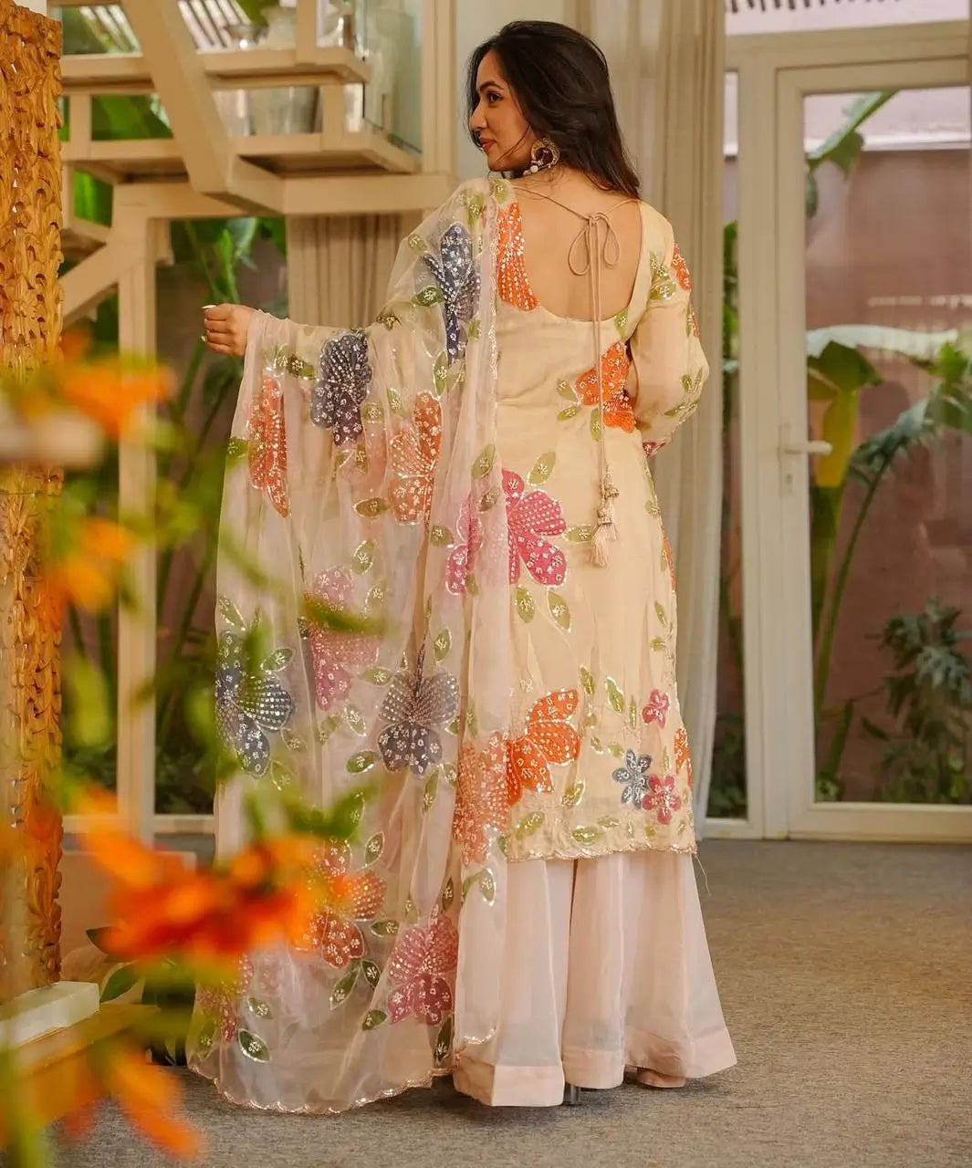 Back view of cream multicolour floral print palazzo set showing full kurta and organza dupatta