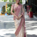 cream organza silk saree with rani pink thread sequin embroidered border model front view