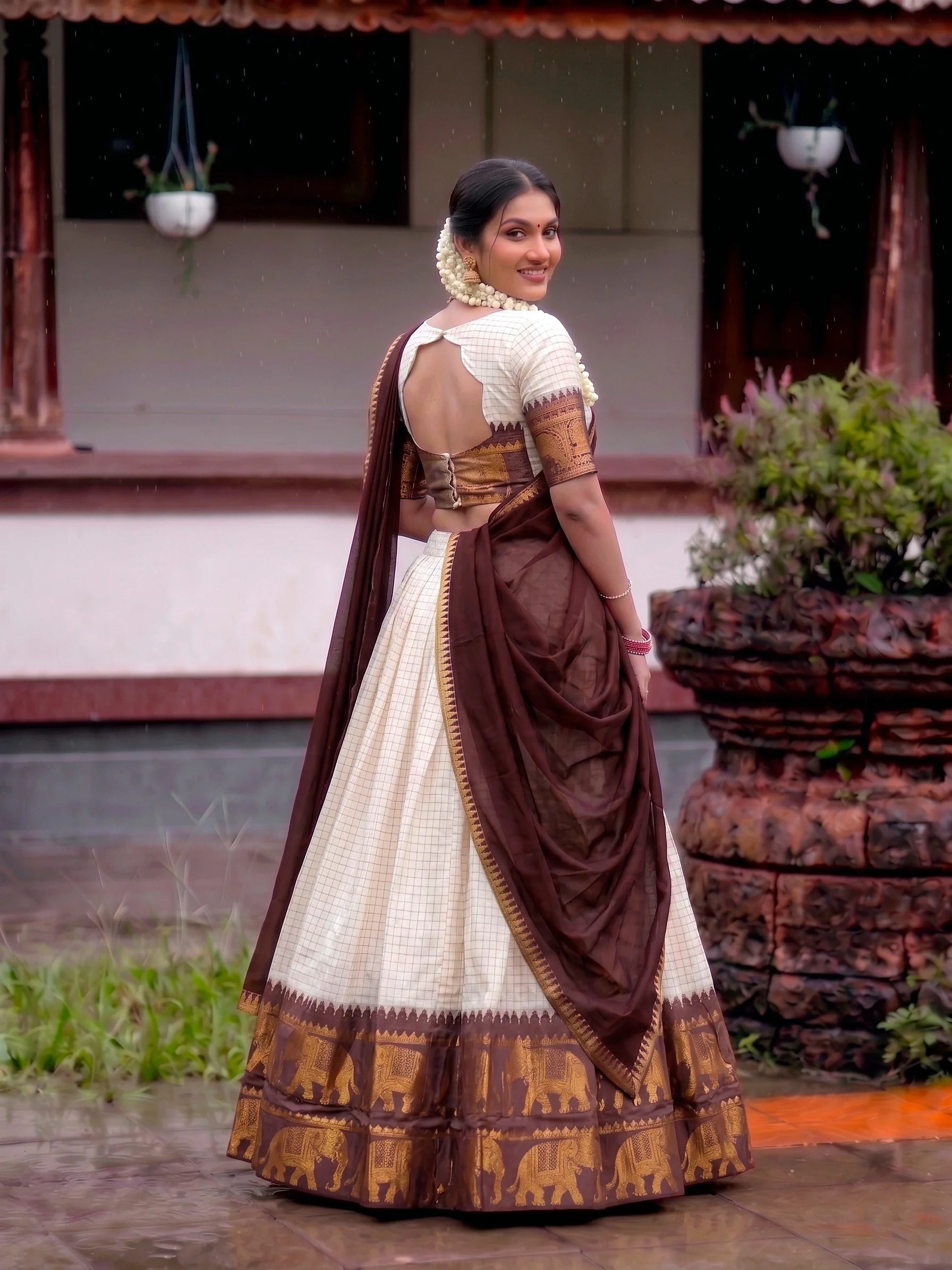Cream poly cotton lehenga dark brown elephant border back view with dupatta