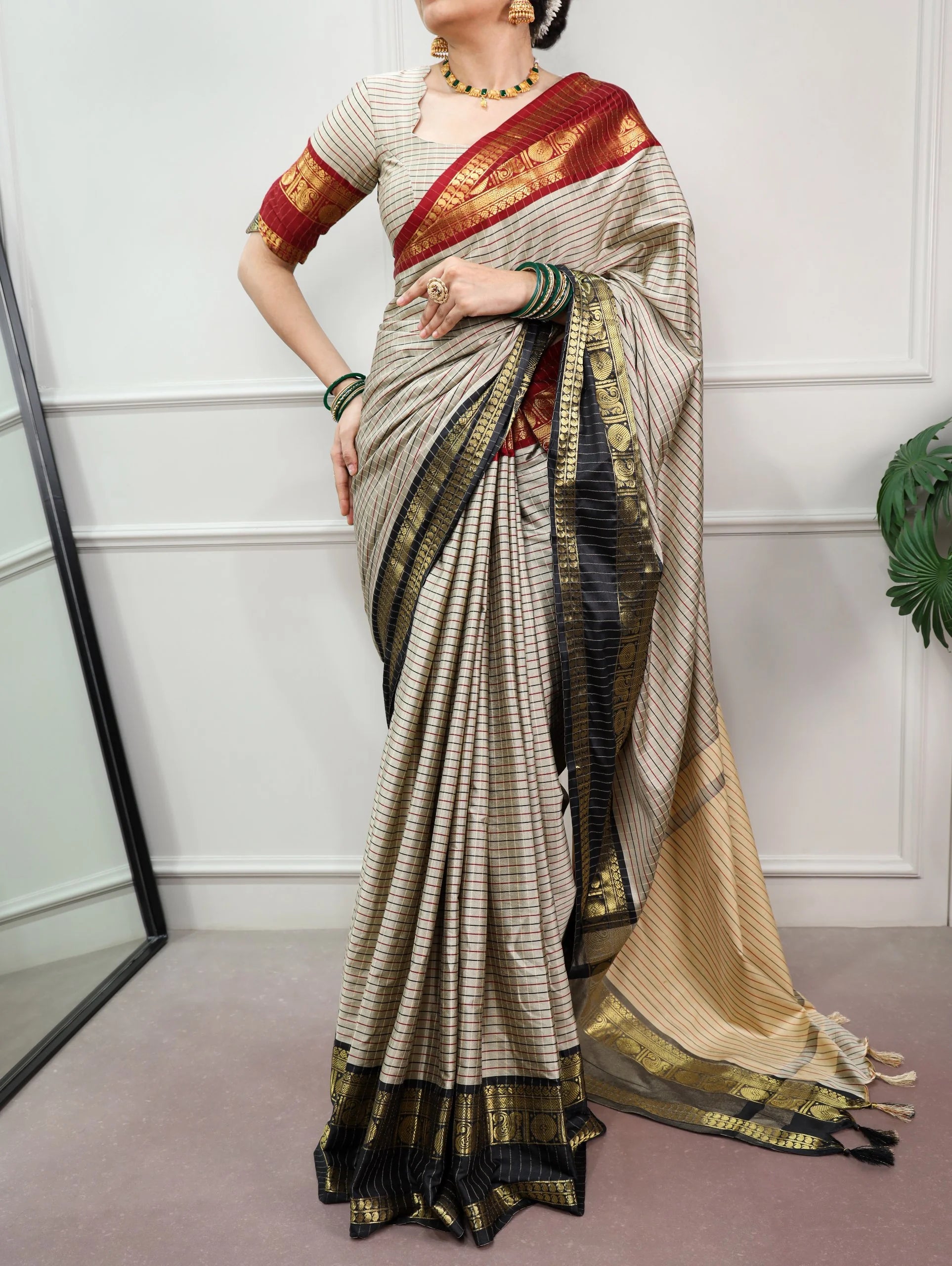 Cream silk saree with checks pattern ornate gold zari border full model view