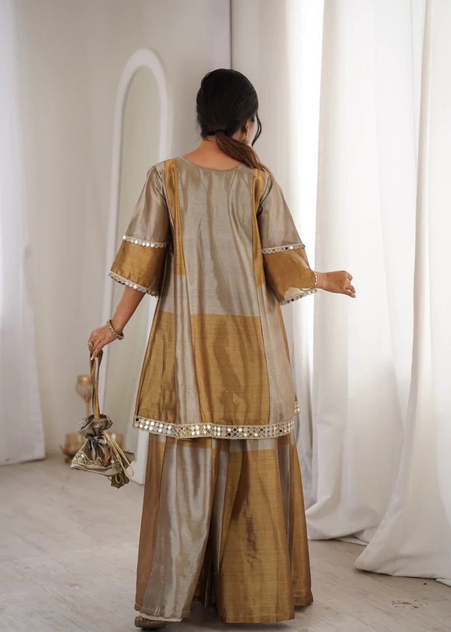 gold tissue ethnic co ord set back view with potli bag