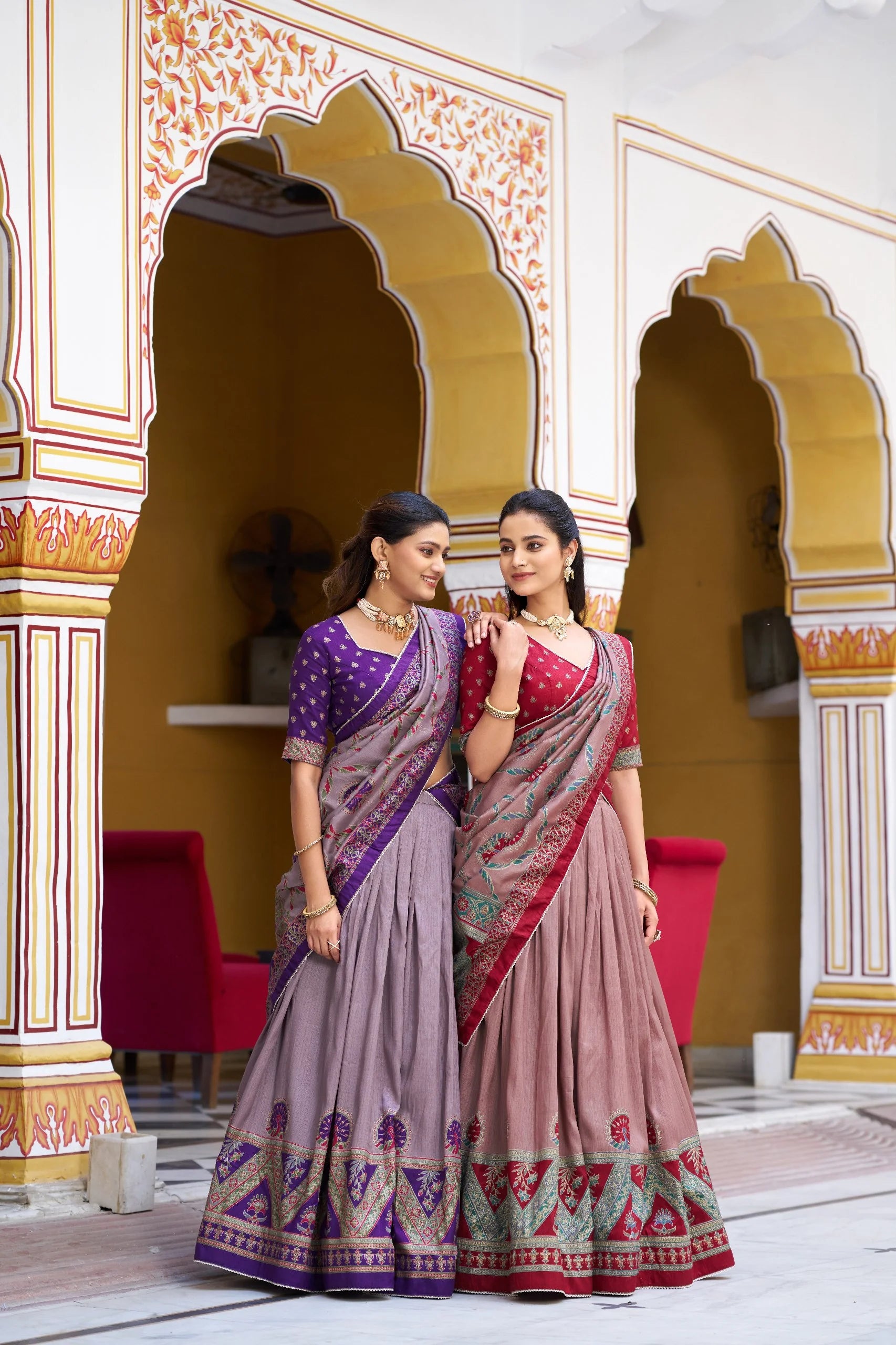 Two colour variants faux georgette lehenga choli set side by side