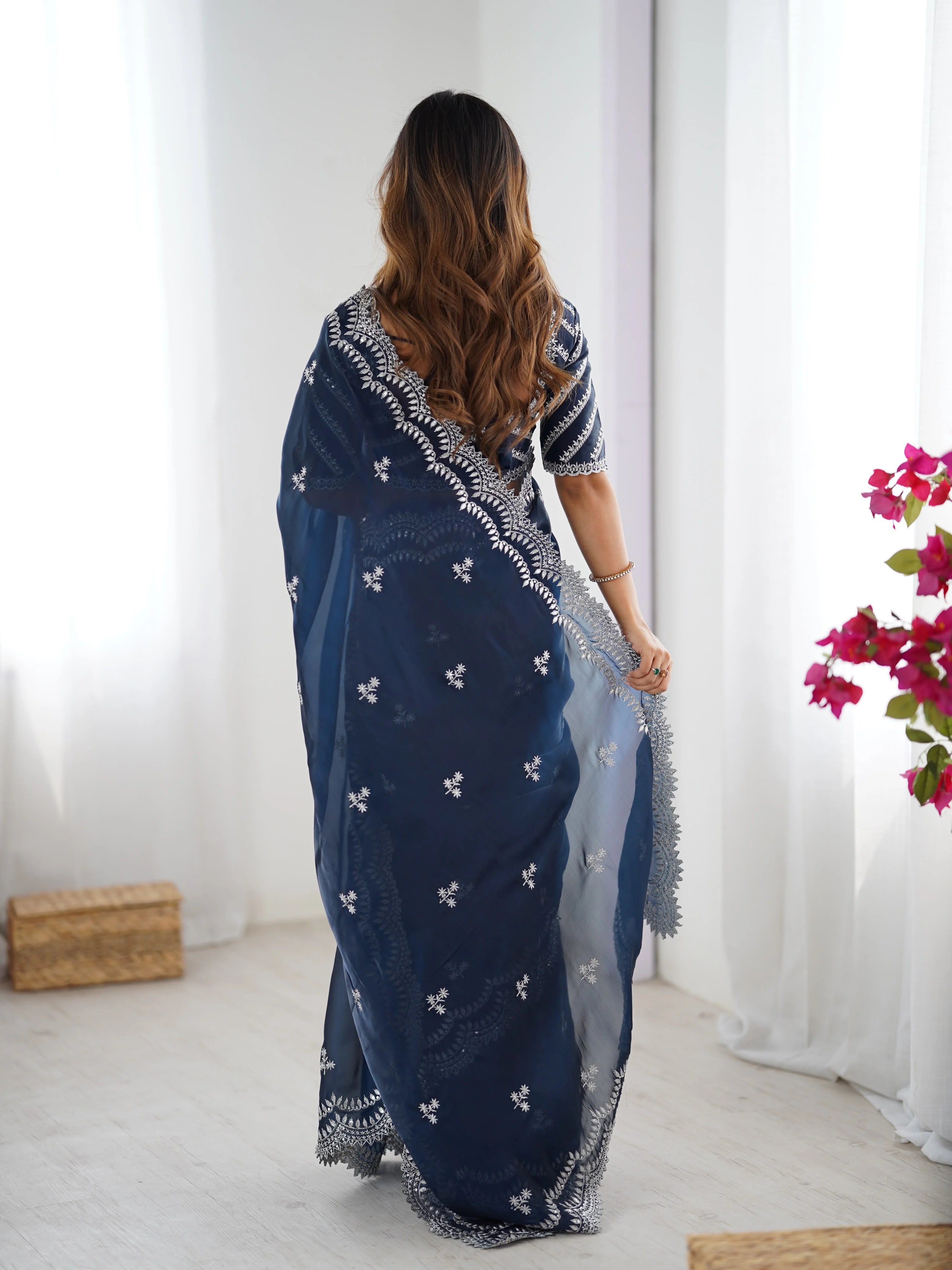 Navy blue faux georgette saree with thread embroidery — back view scalloped border
