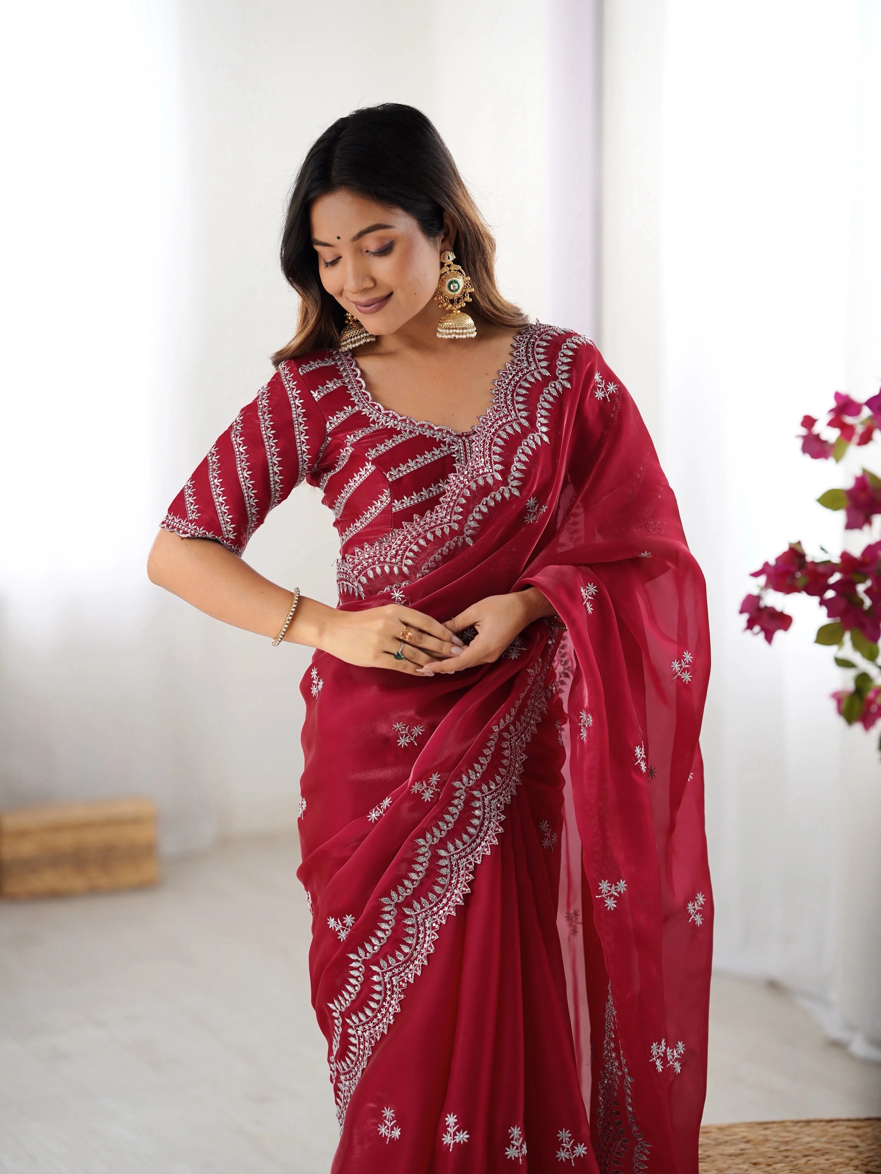Navy blue faux georgette saree — side pose with silver arch border embroidery visible