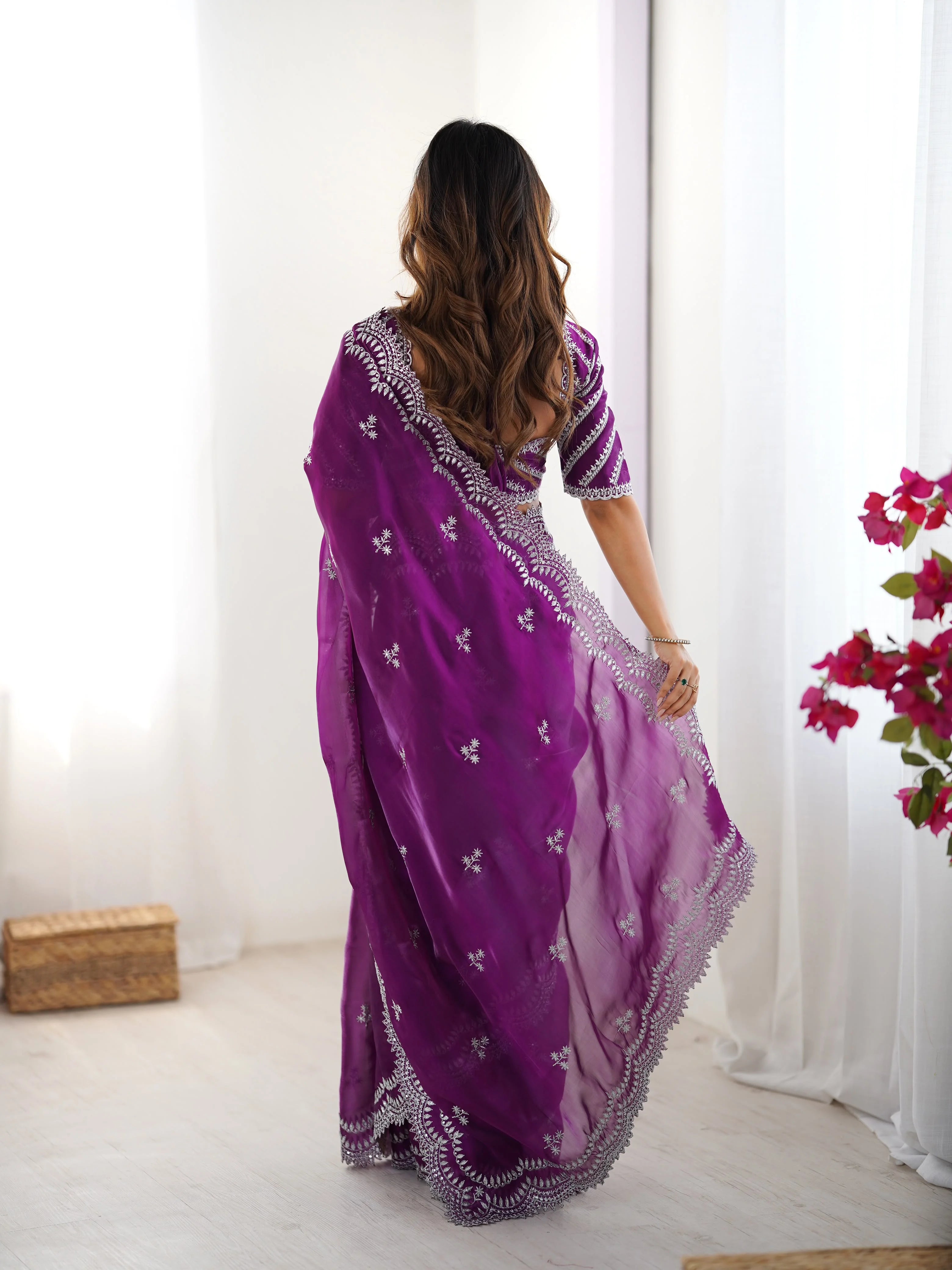 Purple faux georgette saree back view — scalloped arch embroidery running full border