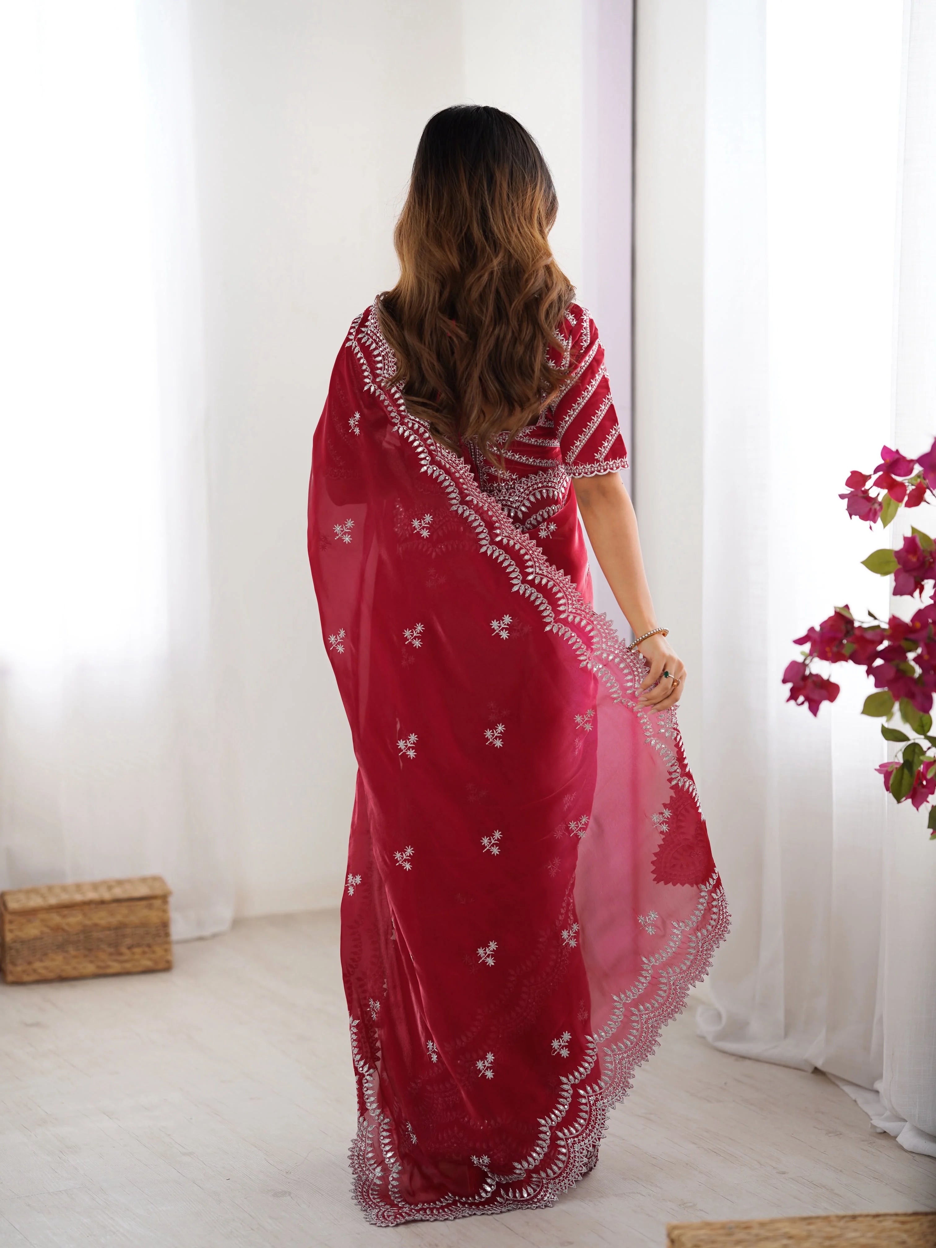 Red georgette saree with silver thread embroidery — elegant front side pose