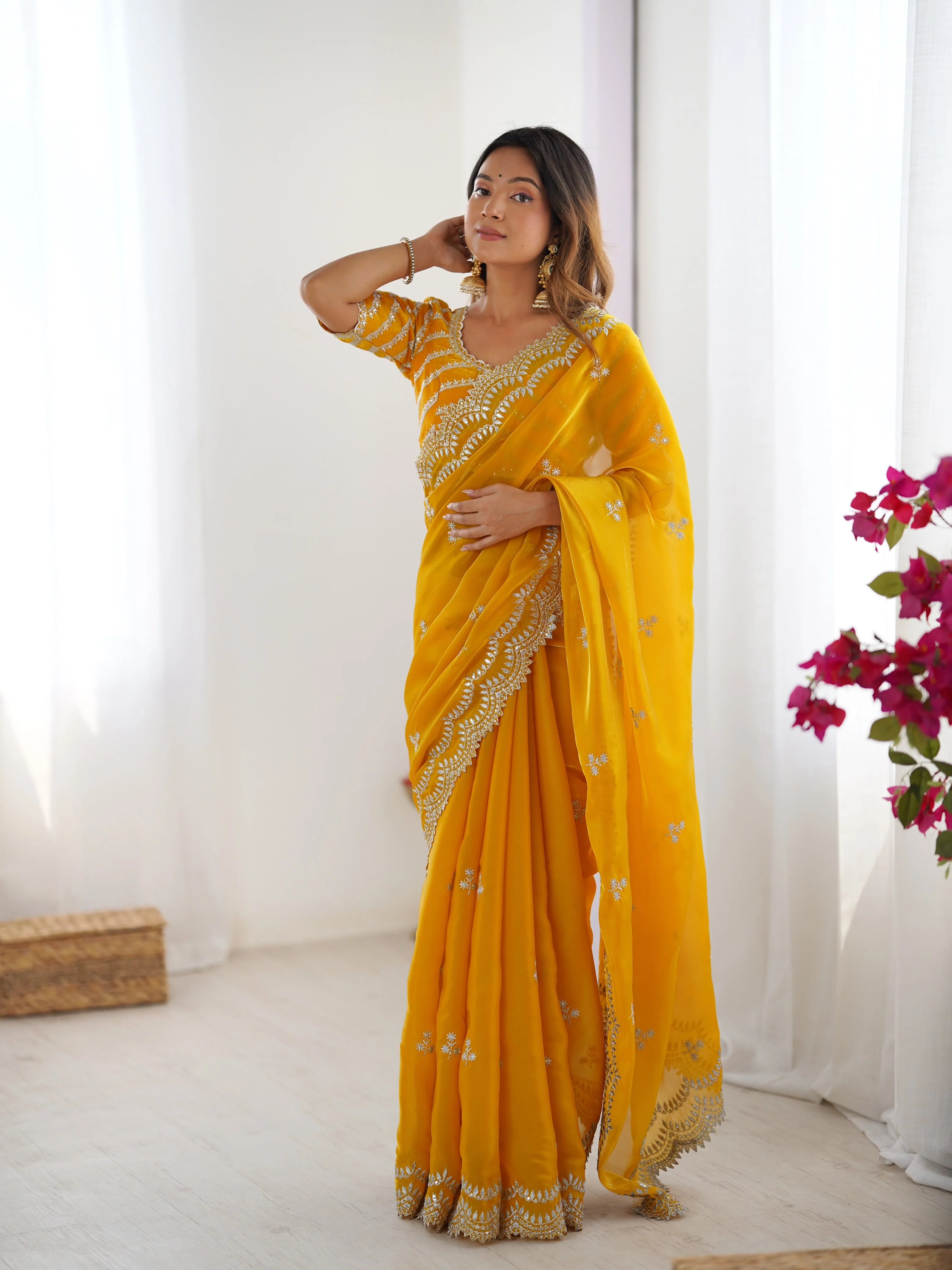 Yellow georgette saree with silver thread embroidery — full body front view