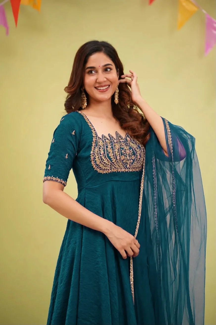 Fendy crush gown with cut dana work teal blue lotus petal yoke and net dupatta – front view