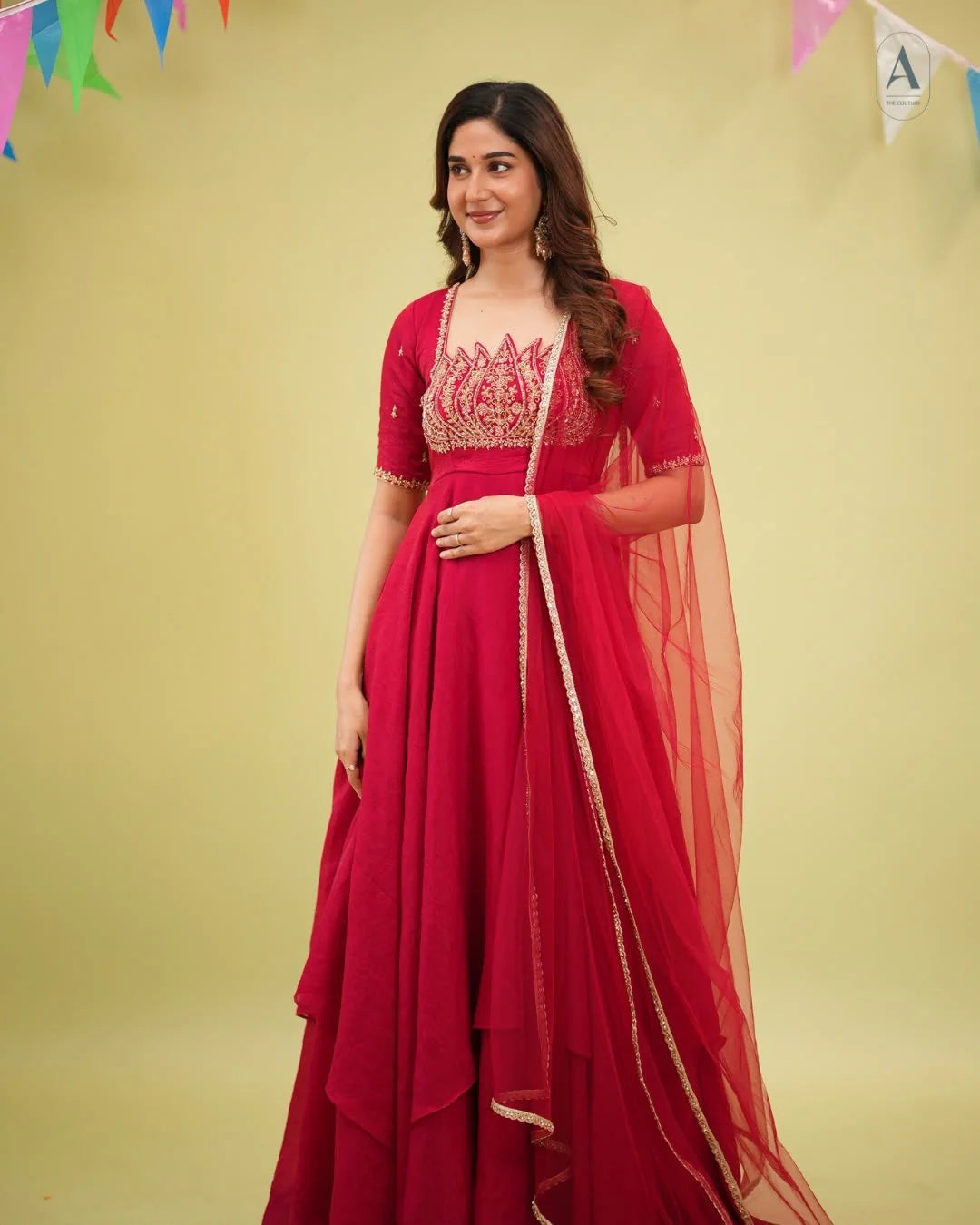 Red fendy crush gown with net dupatta full length outdoor festive view
