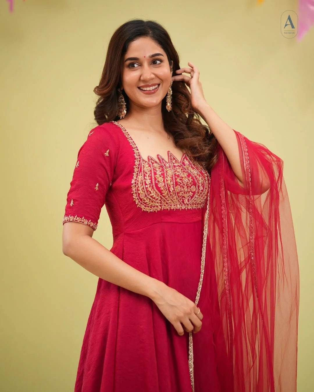 Fendy crush gown with cut dana work red portrait view smiling festive look