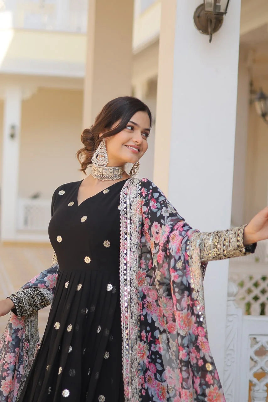 black gown with floral dupatta arms out full view