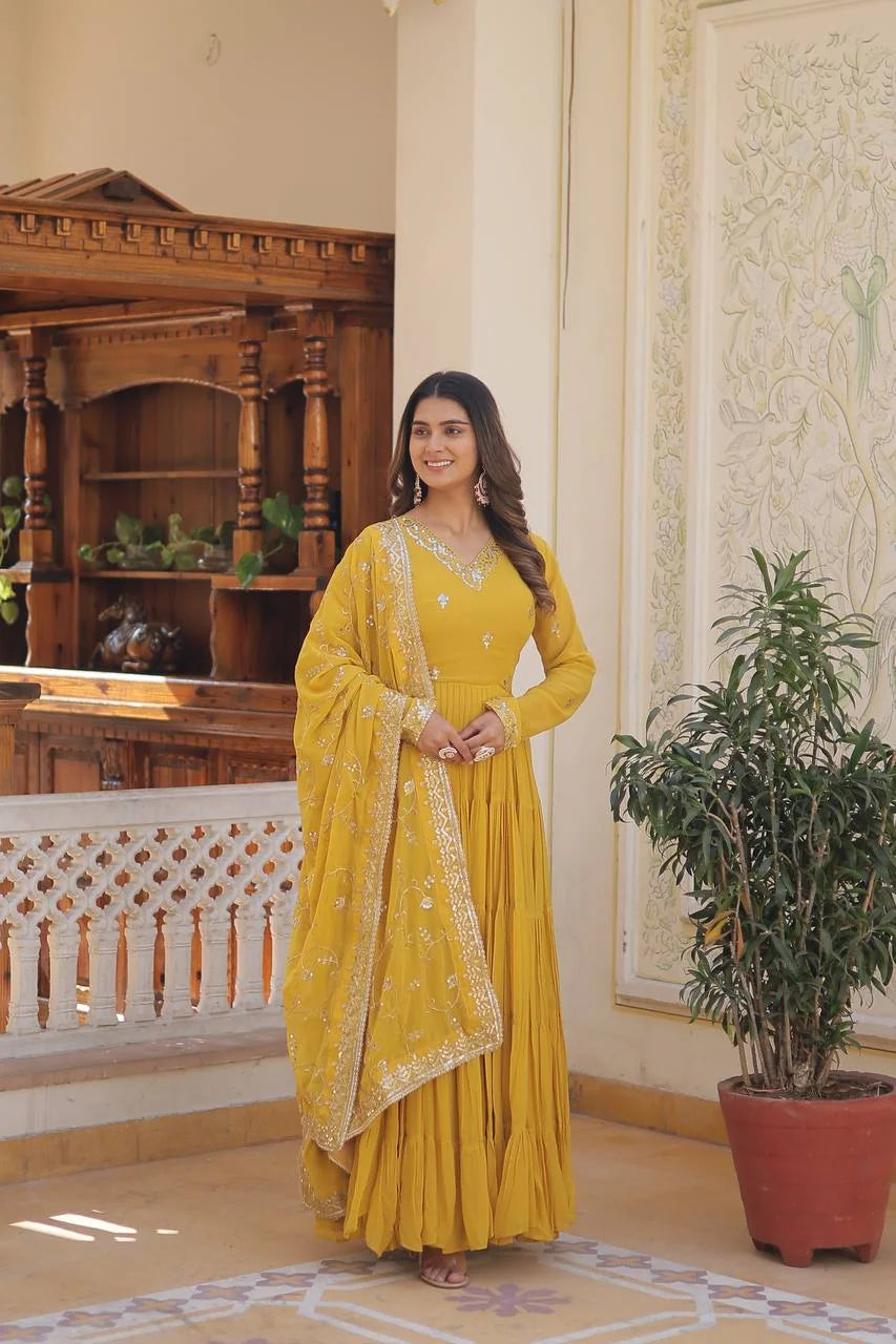 yellow tiered frill gown standing full with sequin dupatta