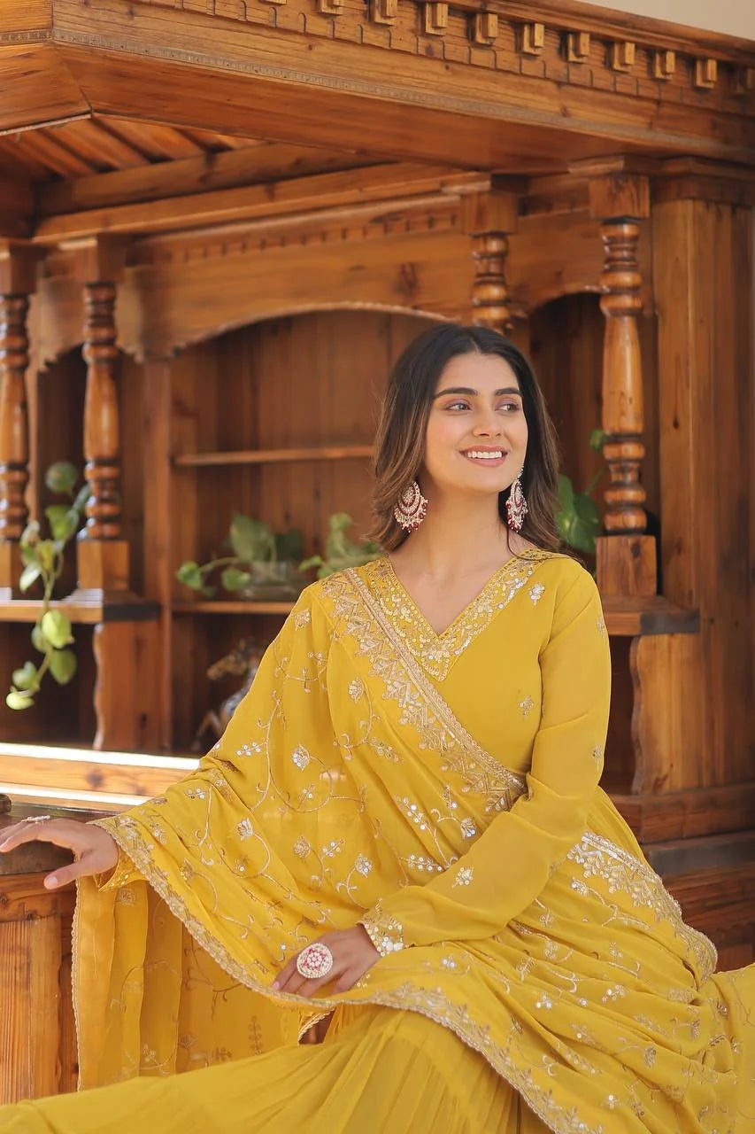 yellow georgette gown seated closeup sequin dupatta
