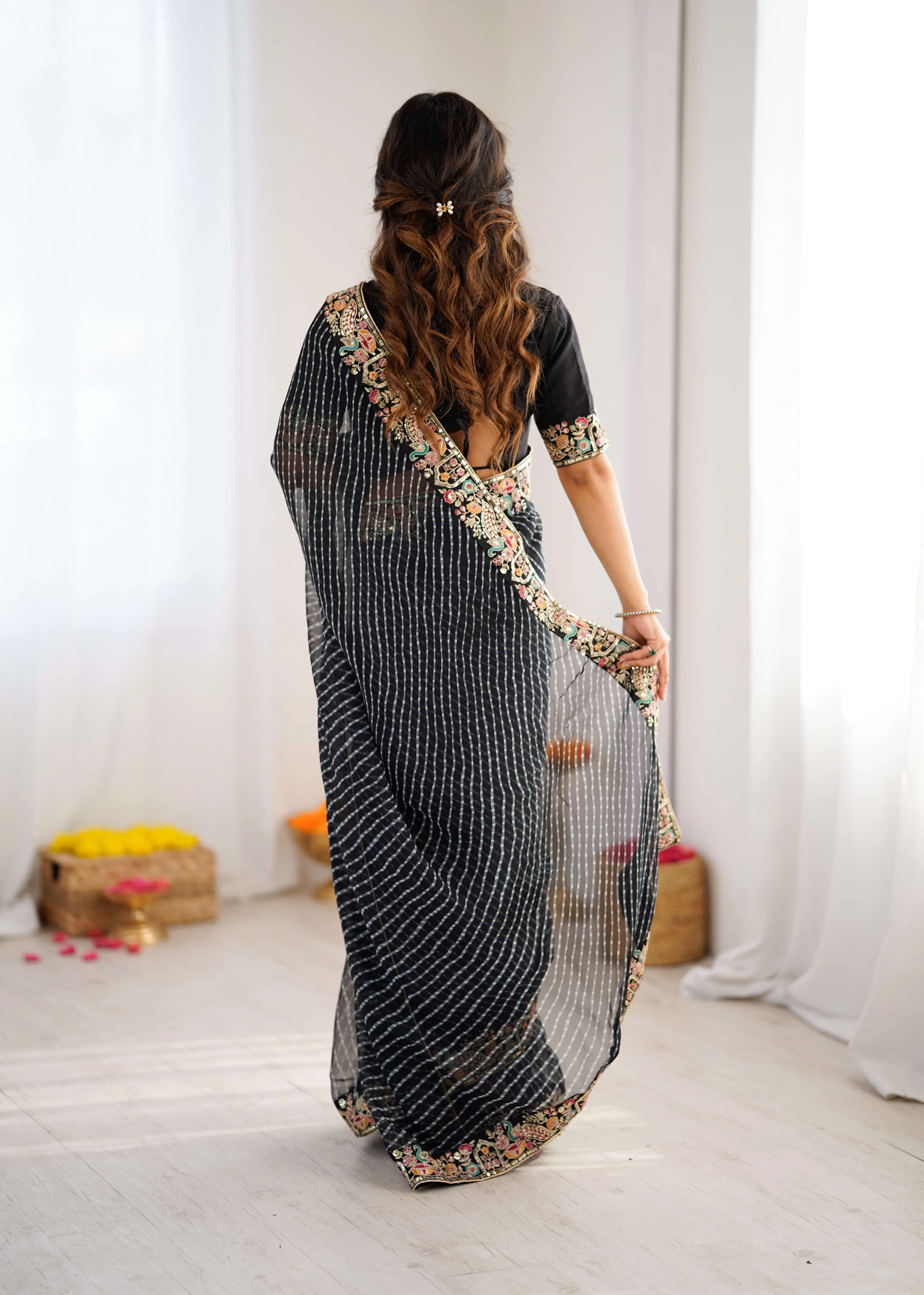 black georgette leheriya saree side standing view