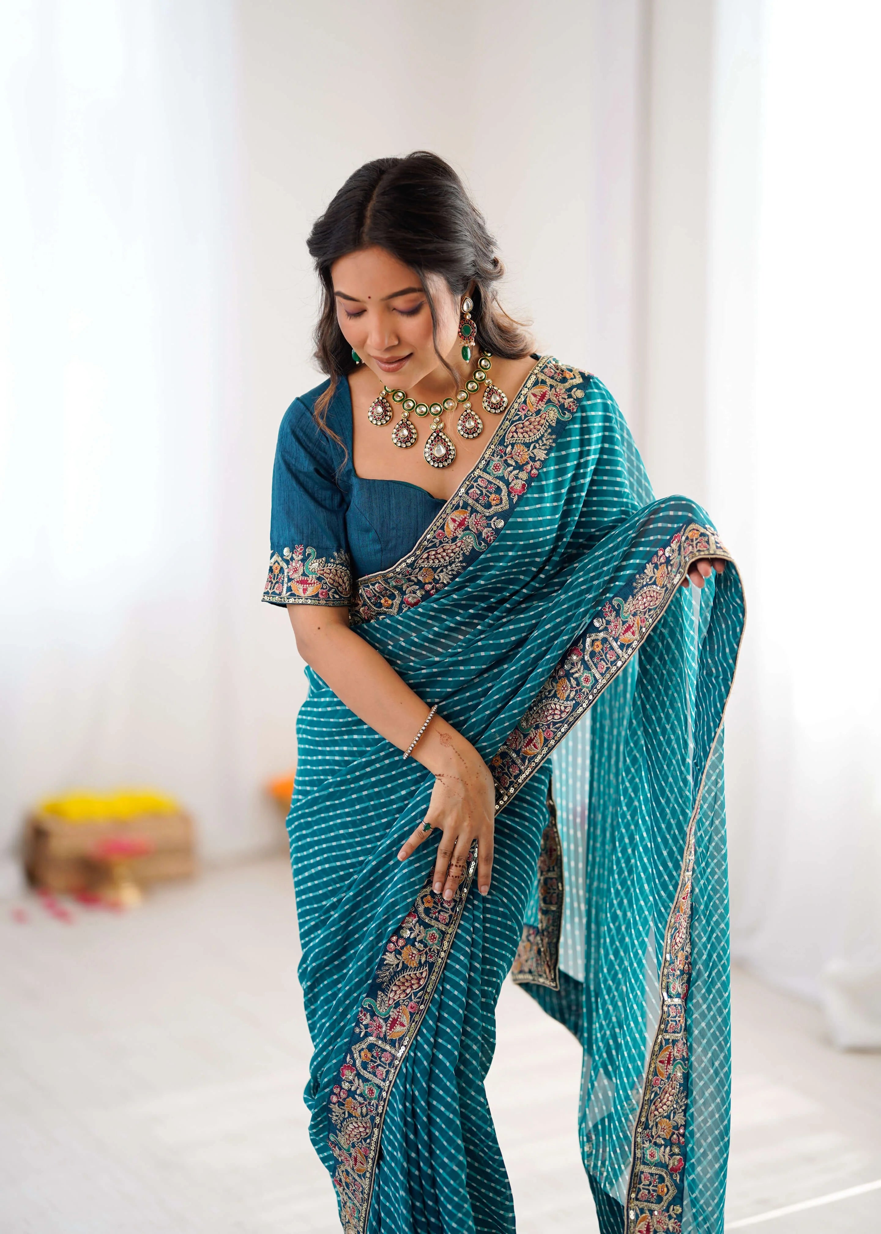 teal georgette leheriya saree border detail close up