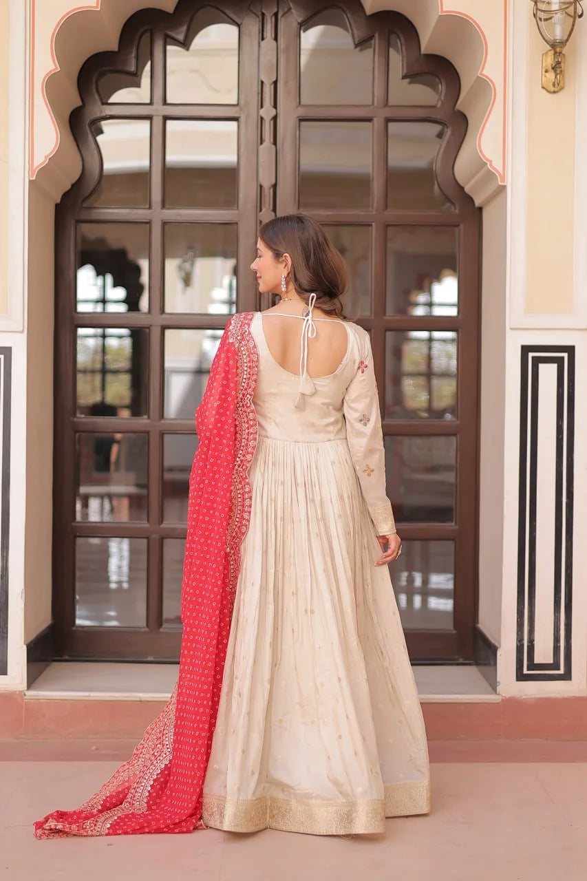 ivory gown back view with red bandhani dupatta drape