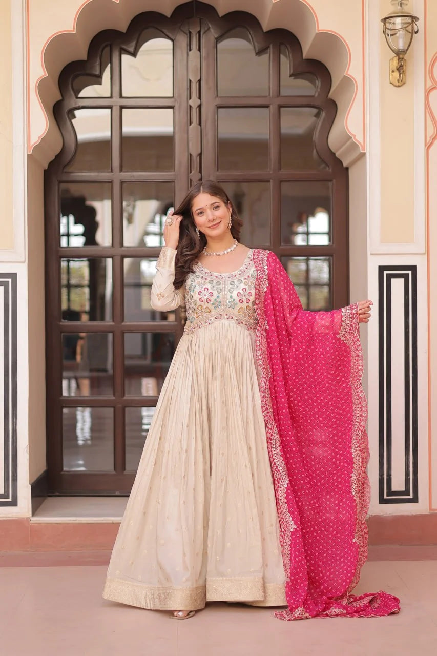 ivory gown with red bandhani dupatta front standing view
