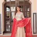 ivory gown with red bandhani dupatta spread full view