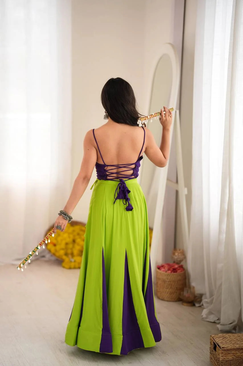 back view of green purple garba lehenga with lace-up tie choli and contrast panels