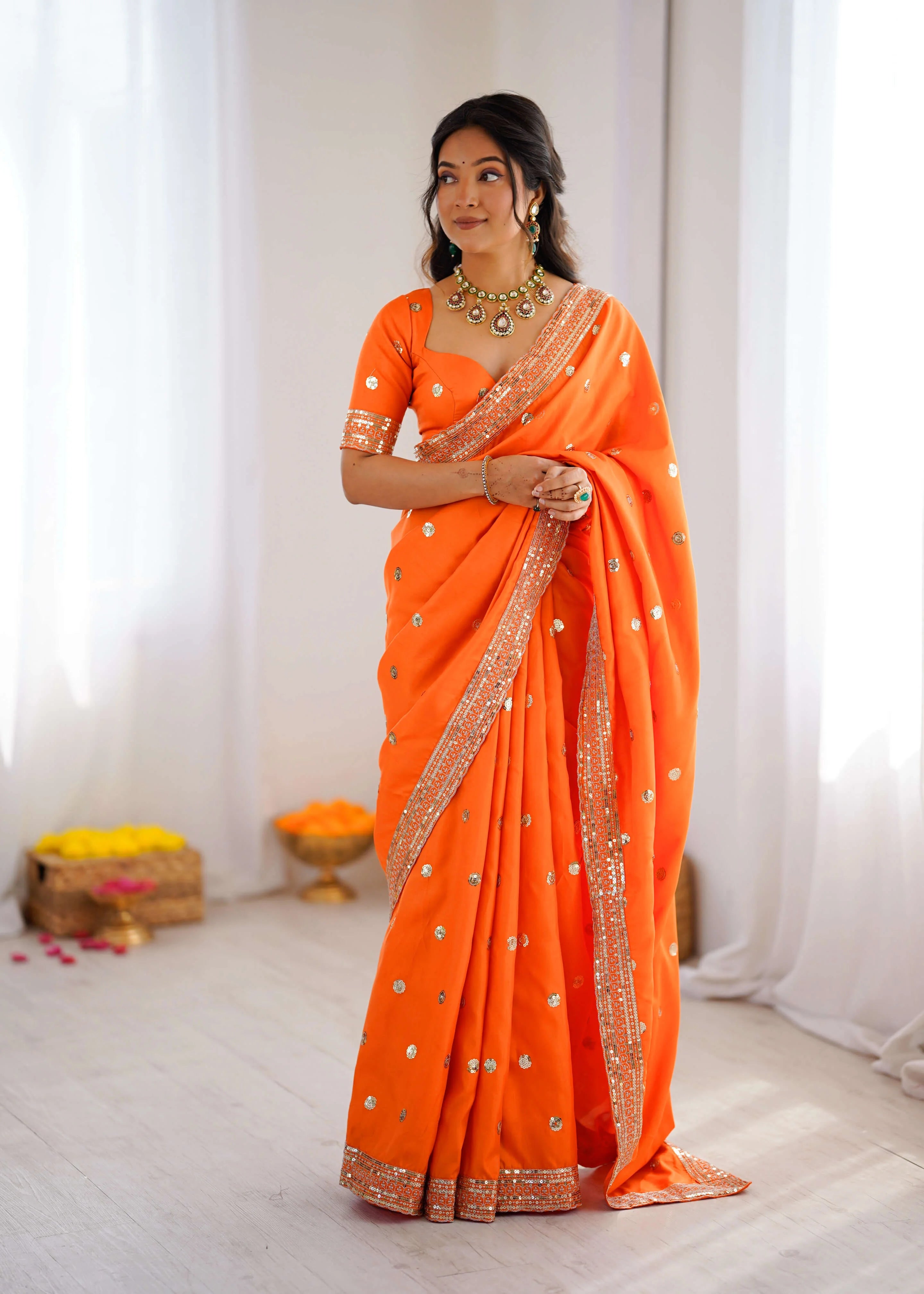 Orange georgette saree with sequin thread work front drape view
