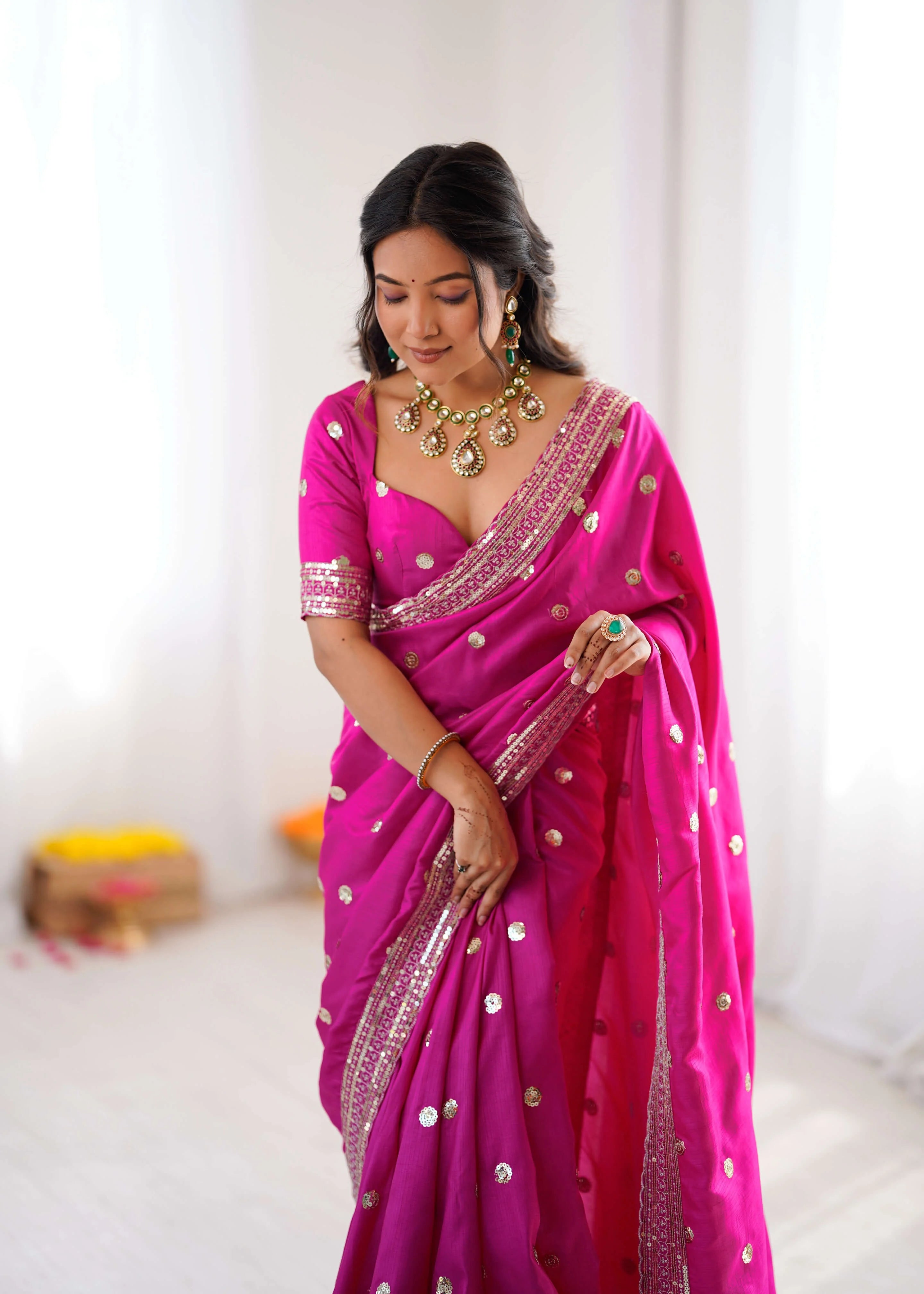 Rani pink georgette saree with sequin butas and thread border blouse