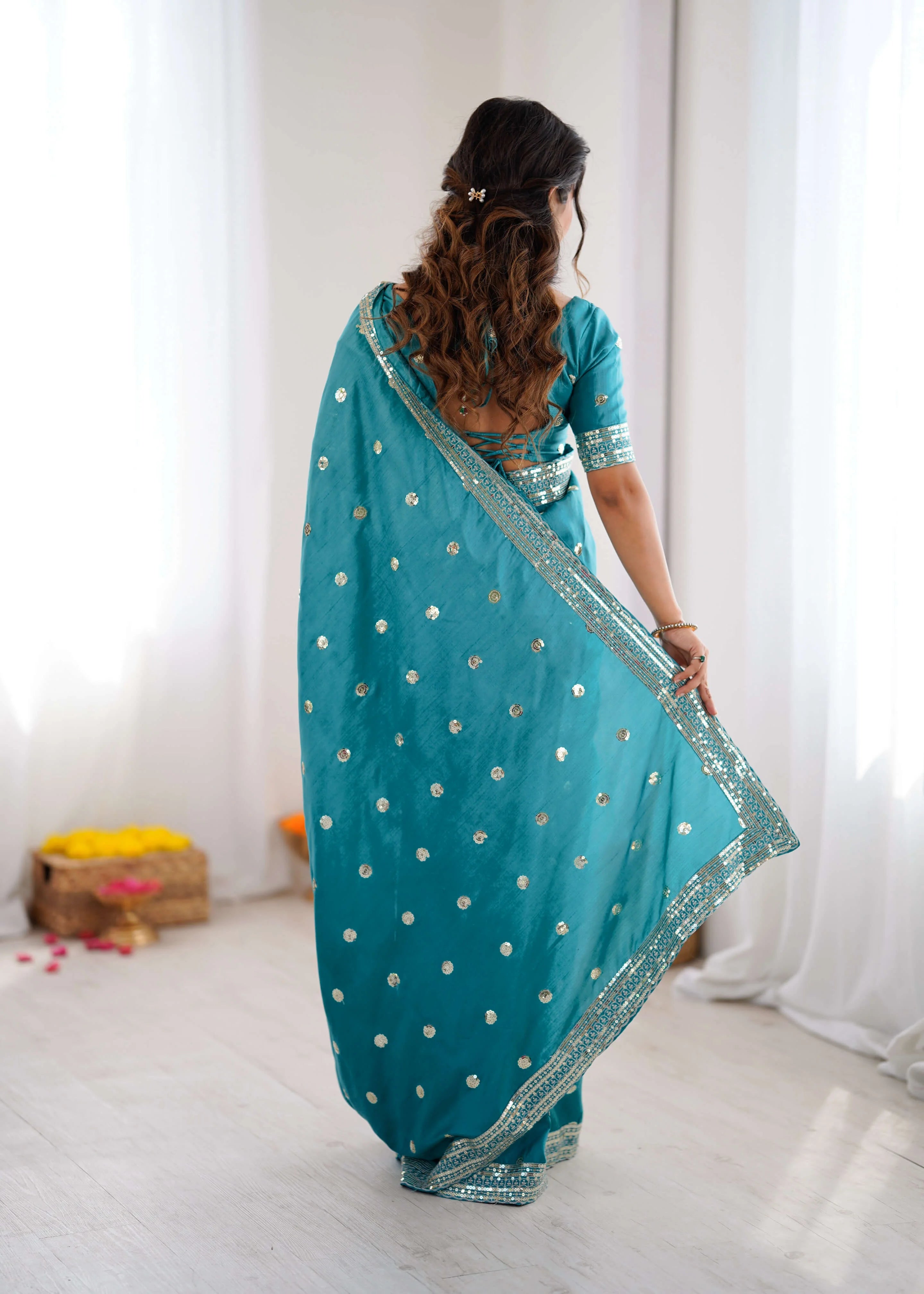 Peacock teal georgette saree with sequin thread work back view