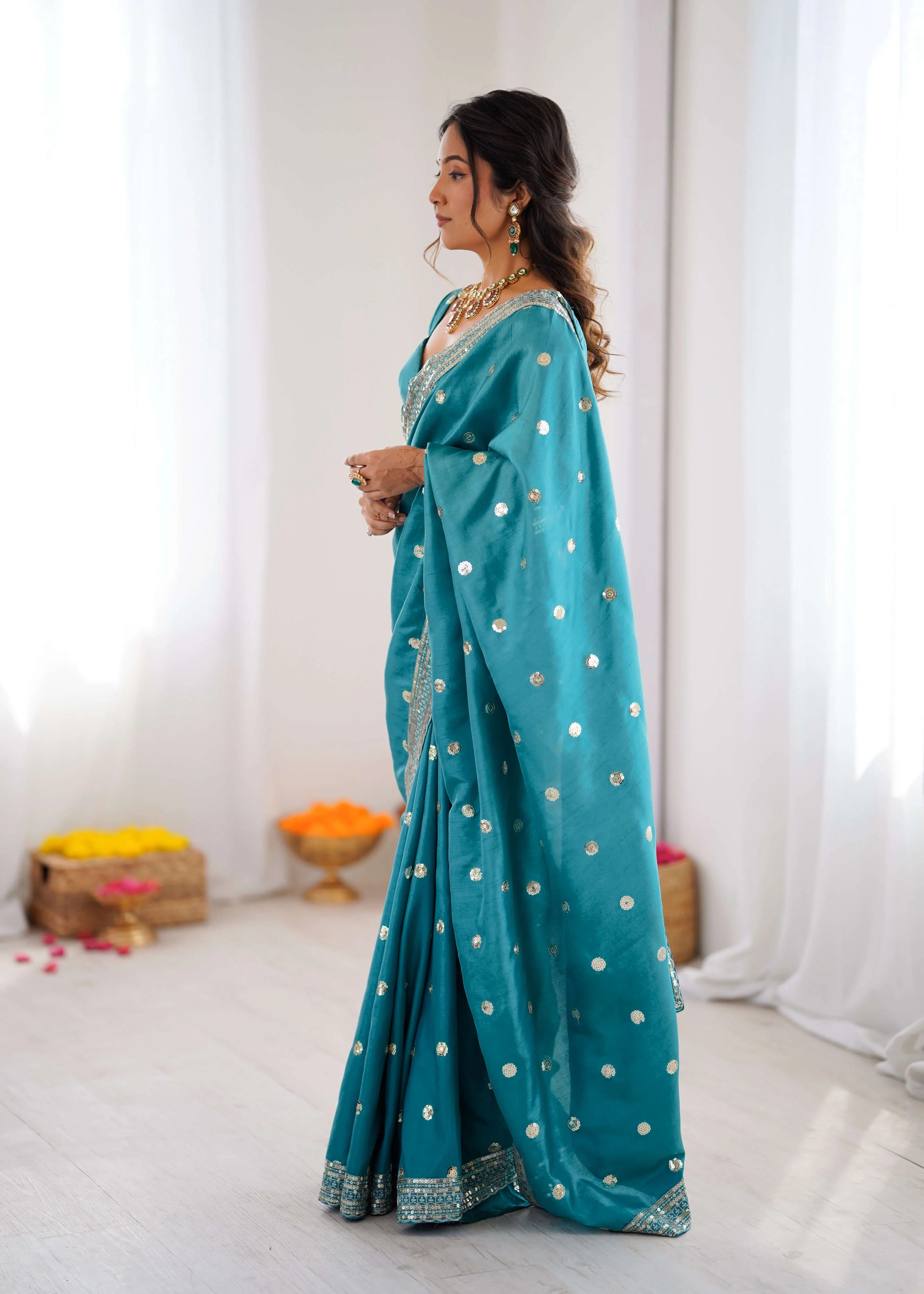 Teal blue georgette designer saree blouse and border detail