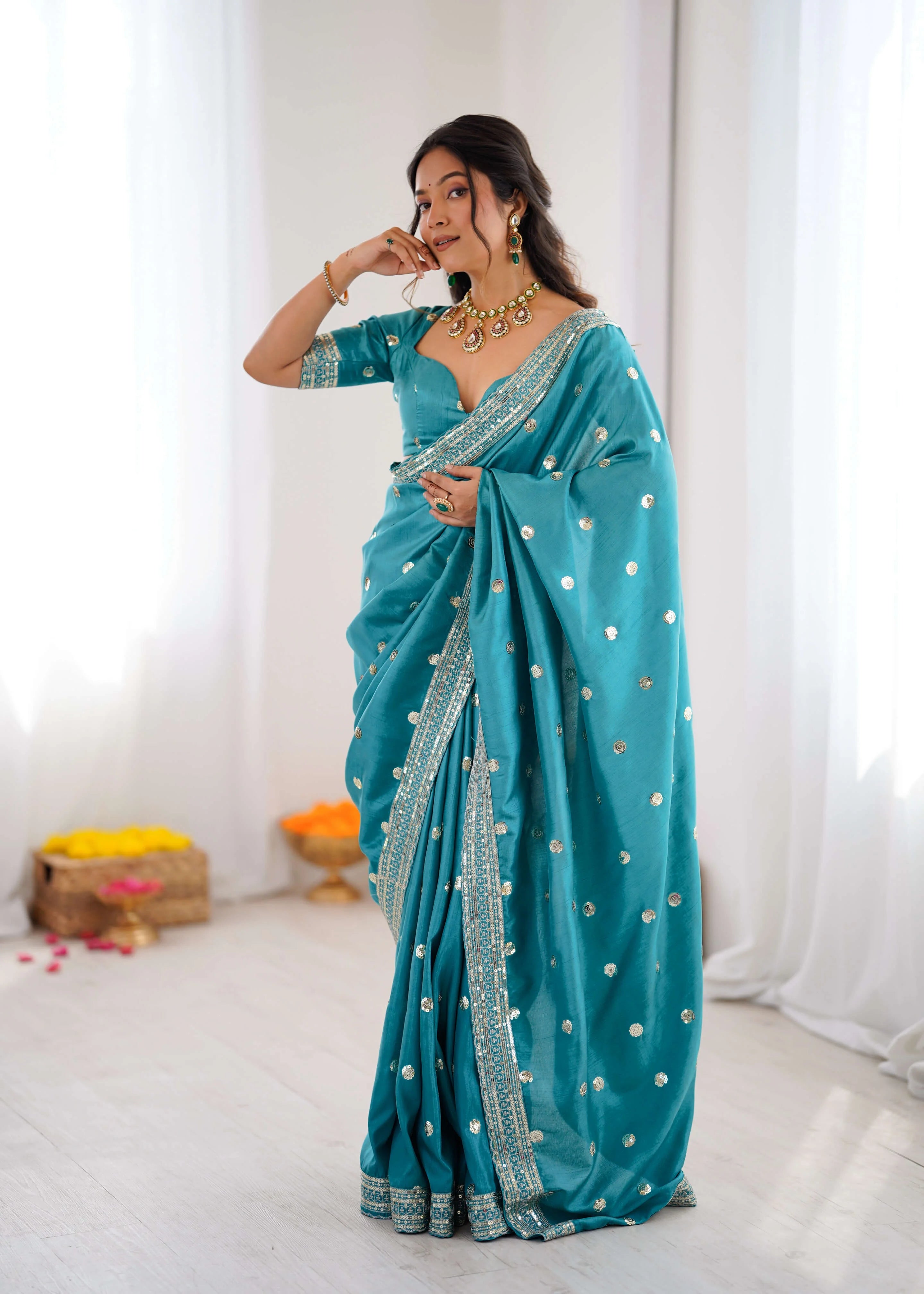 Teal blue georgette saree with sequin work front drape view