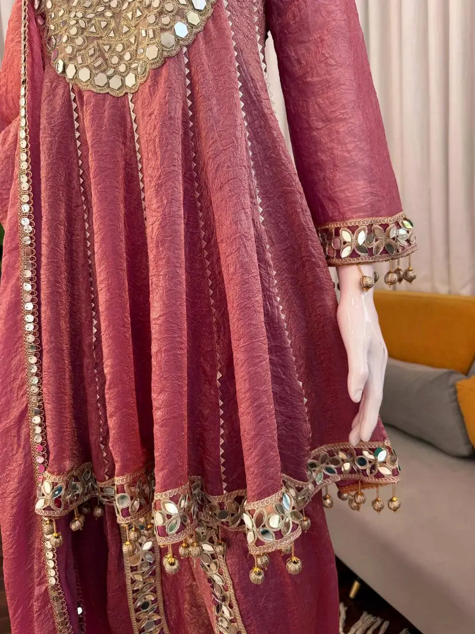 Elegant maroon Anarkali gown with mirror work and gold embroidery, perfect for ethnic occasions