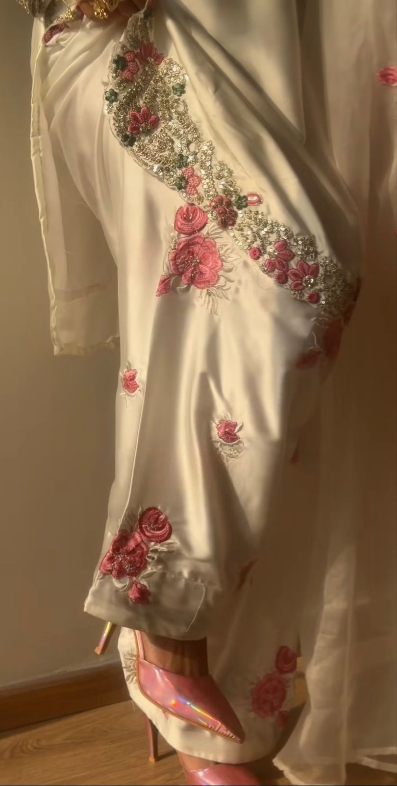 Close-up detail of floral embroidery on ivory pink farshi salwar suit