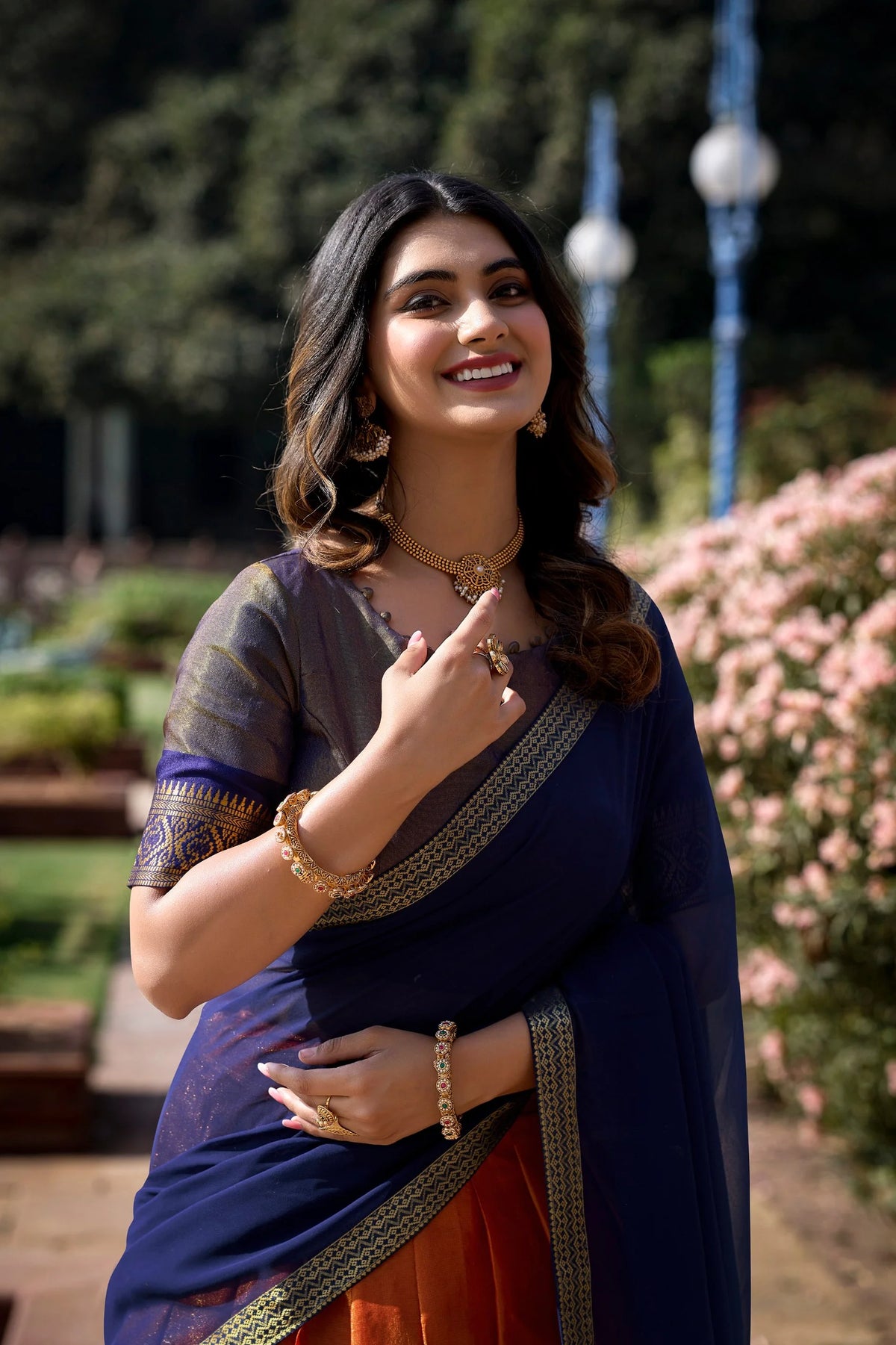 Kanchipuram half saree lehenga set orange and navy blue with 3.70m flared skirt – twirl view