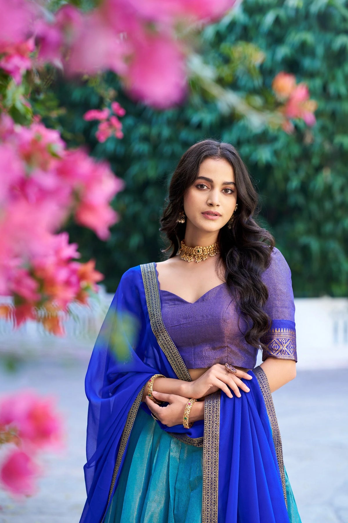 Kanchipuram half saree lehenga set teal and royal blue with zari border – outdoor view