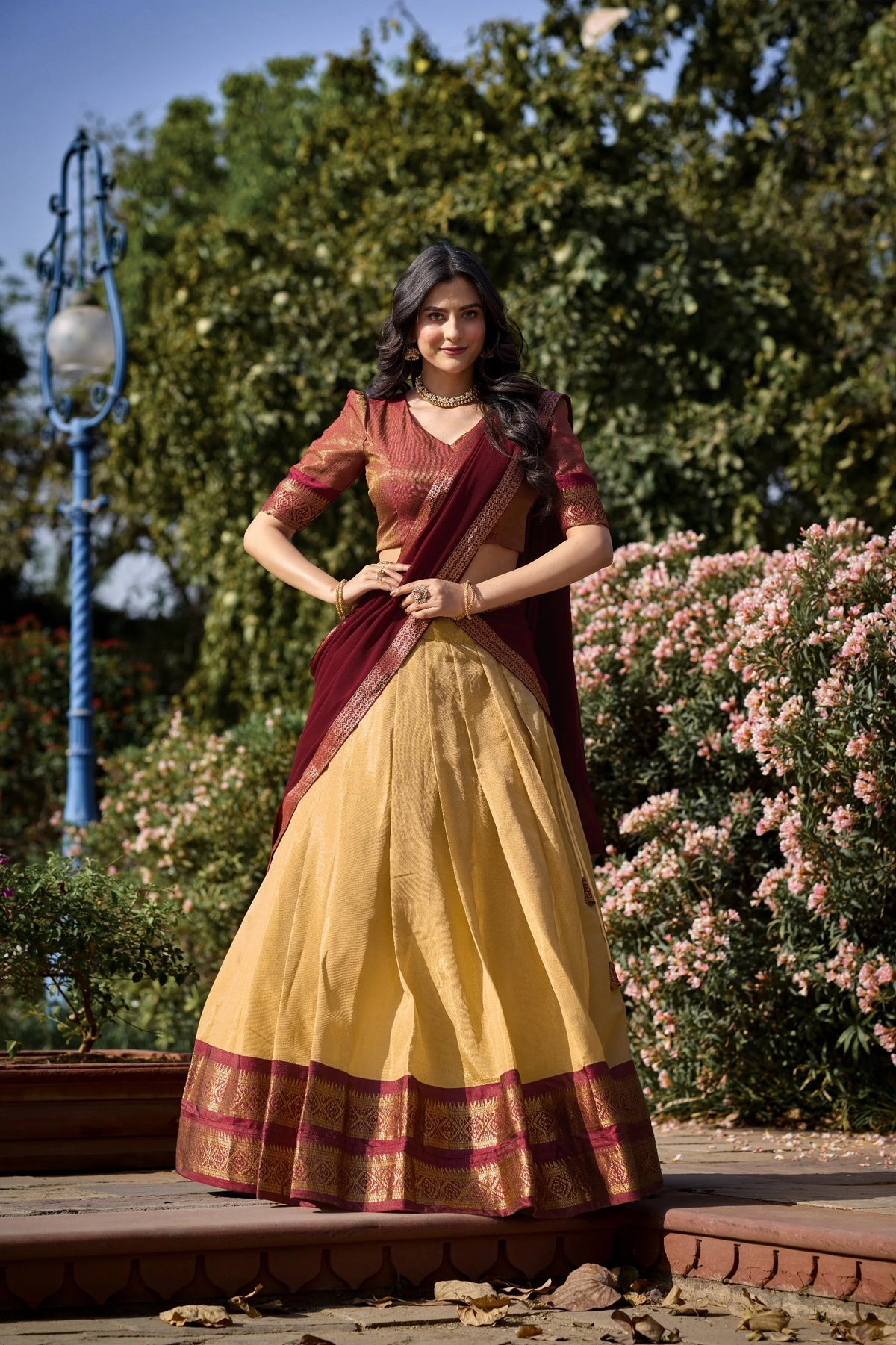 Teal and magenta Kanchipuram half saree lehenga set full length outdoor garden