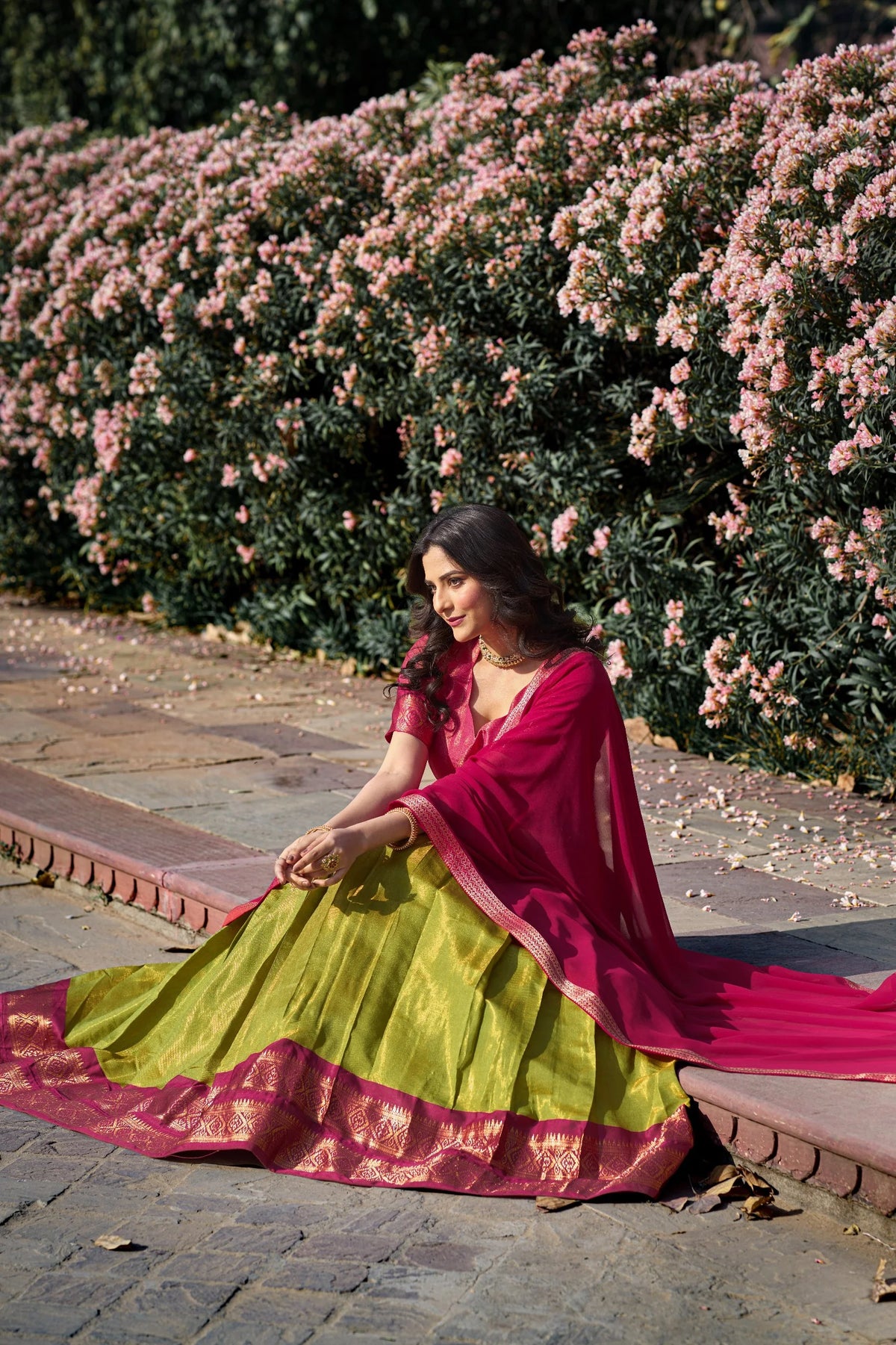 Yellow and maroon Kanchipuram half saree lehenga set full view outdoor