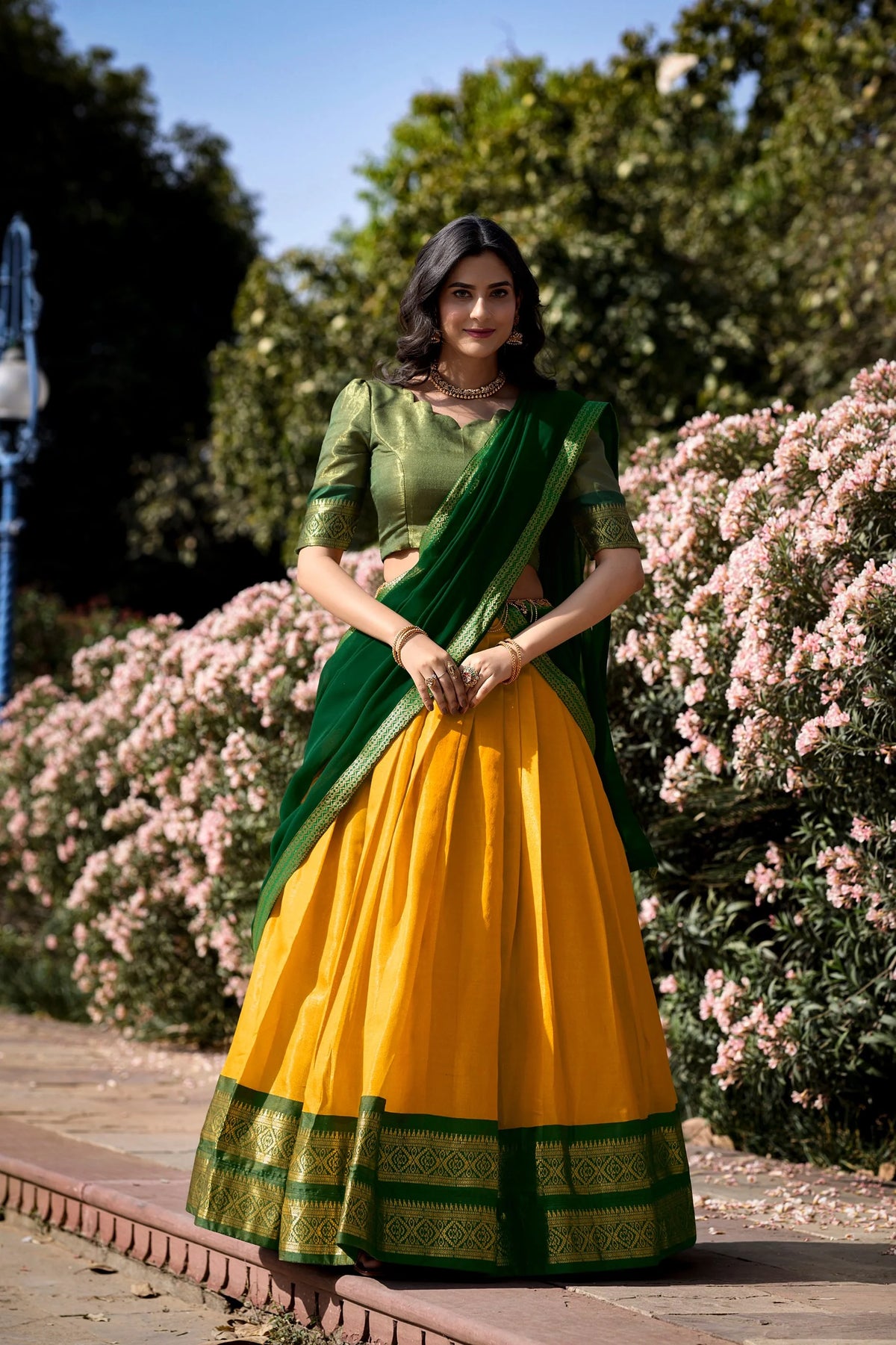 Yellow and pink Kanchipuram half saree lehenga set garden outdoor festive look