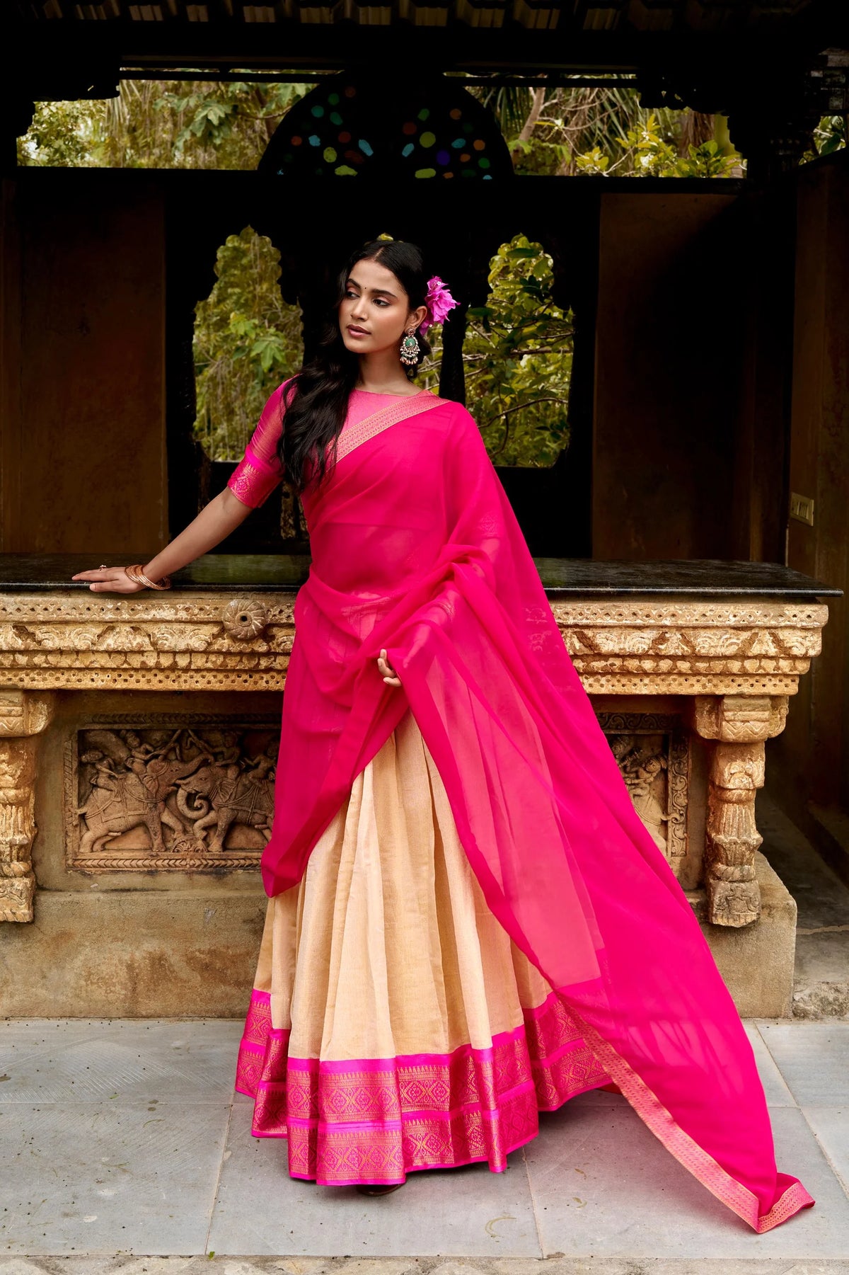 Yellow and red Kanchipuram lehenga set with red zari border at heritage door